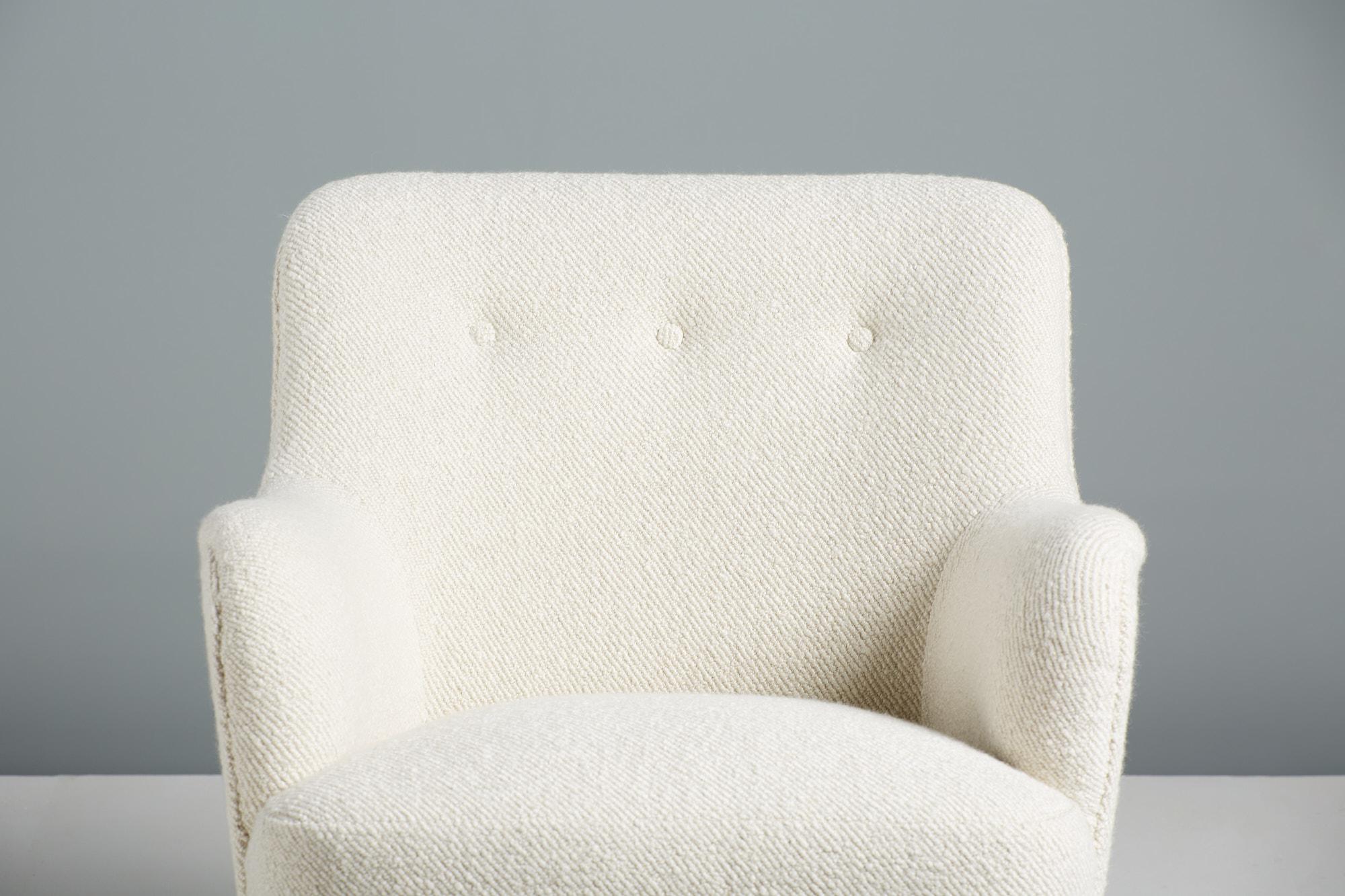 Peter Hvidt - Model 1748 Lounge Chair

A pair of compact lounge chairs produced by Fritz Hansen in Denmark c1940s and designed by Danish icon Peter Hvidt. The chairs have been reupholstered in exquisite wool blend boucle fabric from Dedar Milan. 