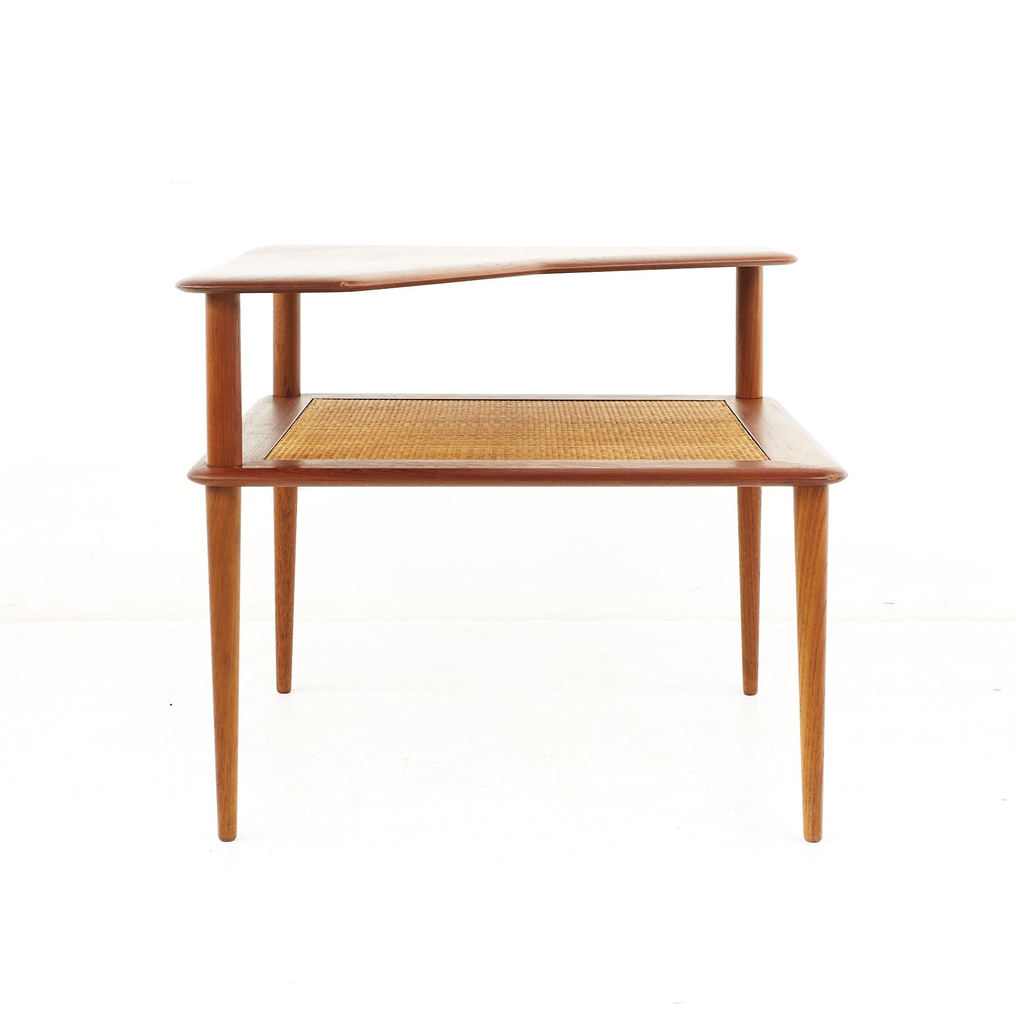 Peter Hvidt Mid Century Teak and Cane Step Corner Table

The table measures: 30 wide x 30 deep x 25 inches high

All pieces of furniture can be had in what we call restored vintage condition. That means the piece is restored upon purchase so