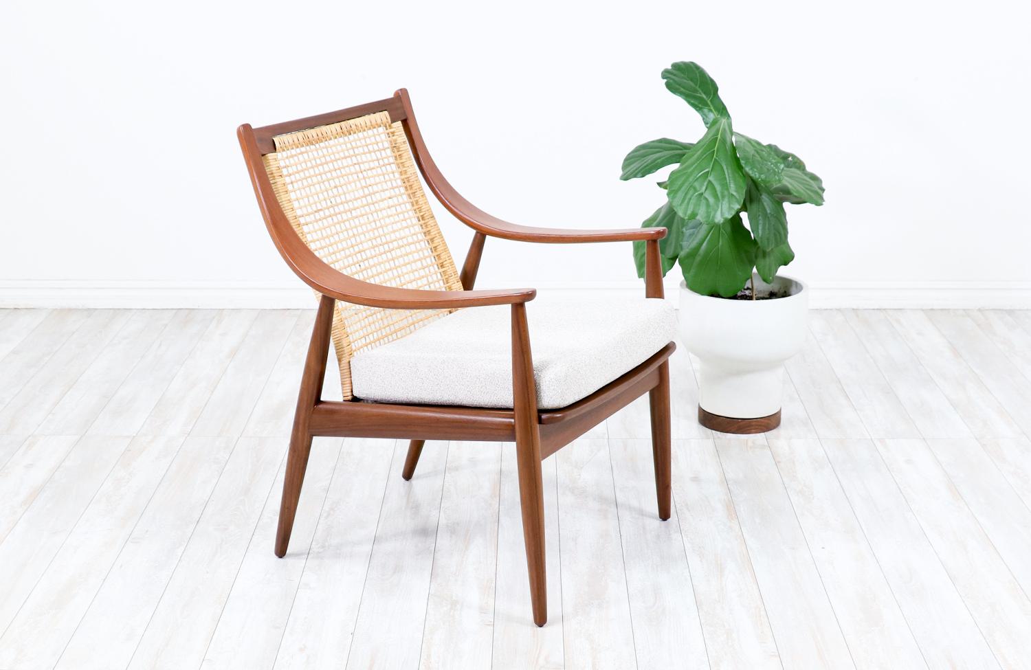 Pair of lounge chairs designed by Peter Hvidt & Orla Mølgaard-Nielsen for France & Daverkosen in Denmark circa 1950’s. This spectacular pair of model FD-146 chairs feature a teak wood frame with a recently upholstered seat cushion in a quality soft