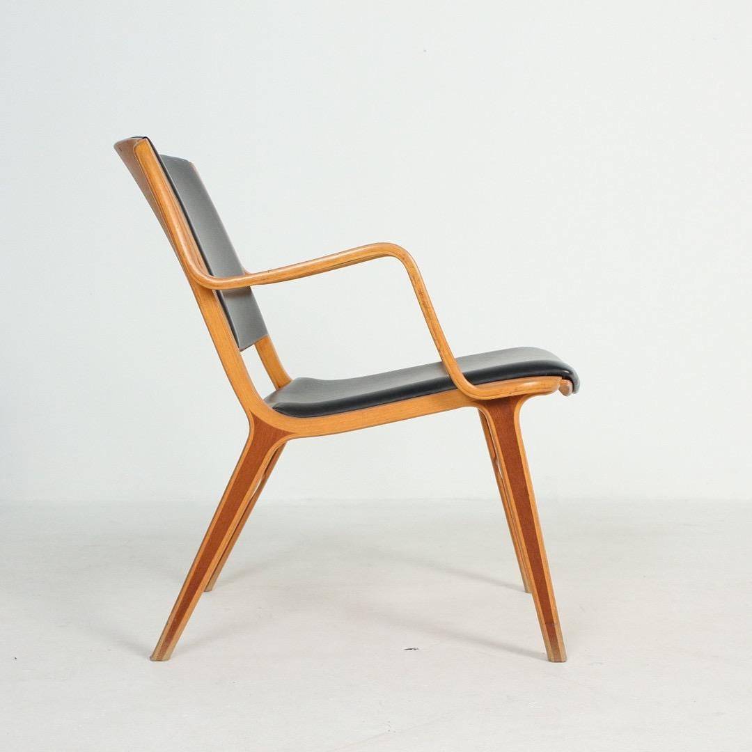 The Ax-chair designed by danish furniture pioneers Peter Hvidt and Orla Möllgard-Nielsen is an interesting chair because rather than forming a plywood shell, it uses laminated and moulded wood for the chair seat and the back rest that are supported