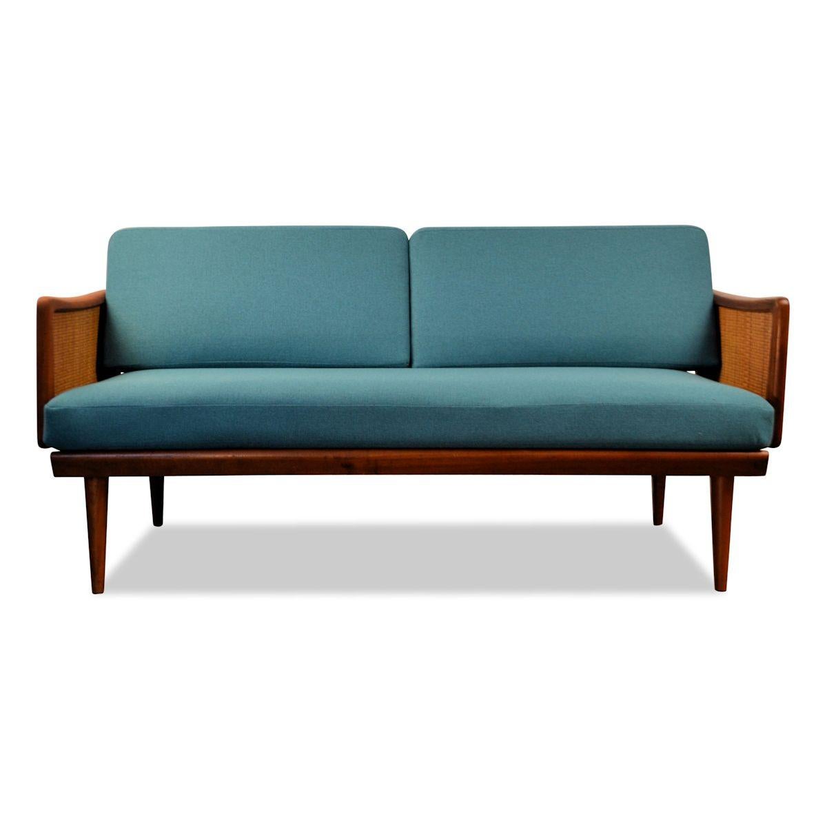 Vintage two-seat sofa designed by the famous Danish designer duo Peter Hvidt & Orla Mølgaard-Nielsen for France & Daverkosen. This model 451 features a typical 1950s Danish design, a lovely combination of teak wood and rattan and new high quality