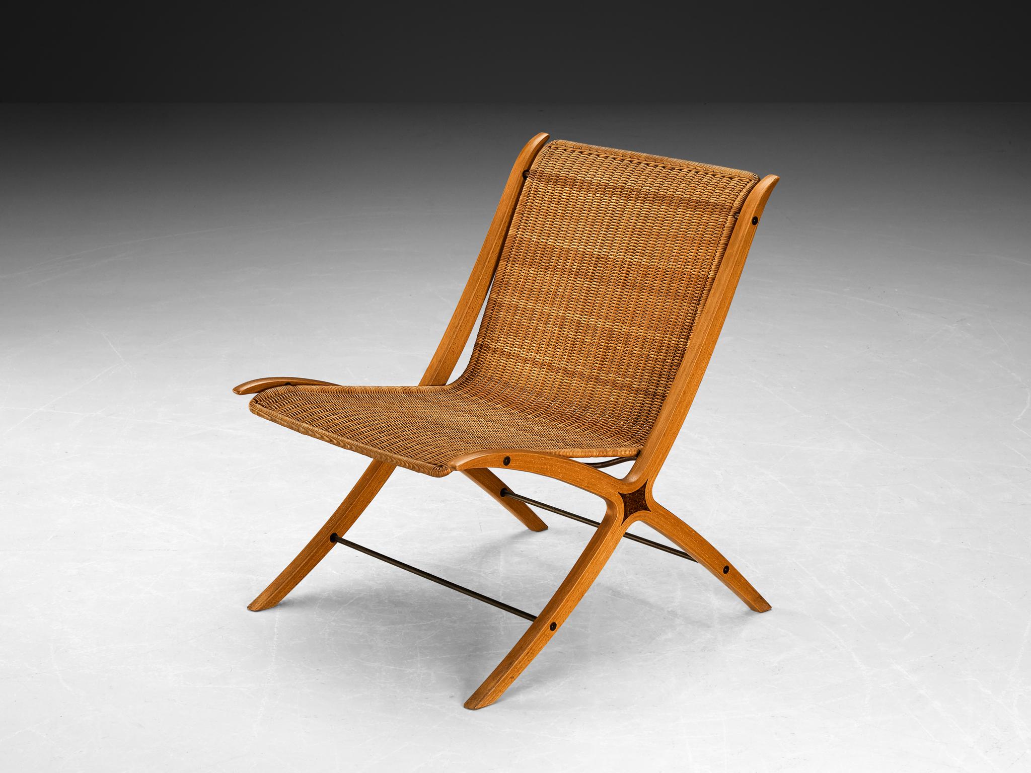 Peter Hvidt & Orla Mølgaard Nielsen for Fritz Hansen, 'X-chair model '6103', cane, wood, beech, Denmark, designed in 1958

This chair is for obvious reasons nicknamed the 'X-chair'. The detailing of this X-design runs all the way from the front legs