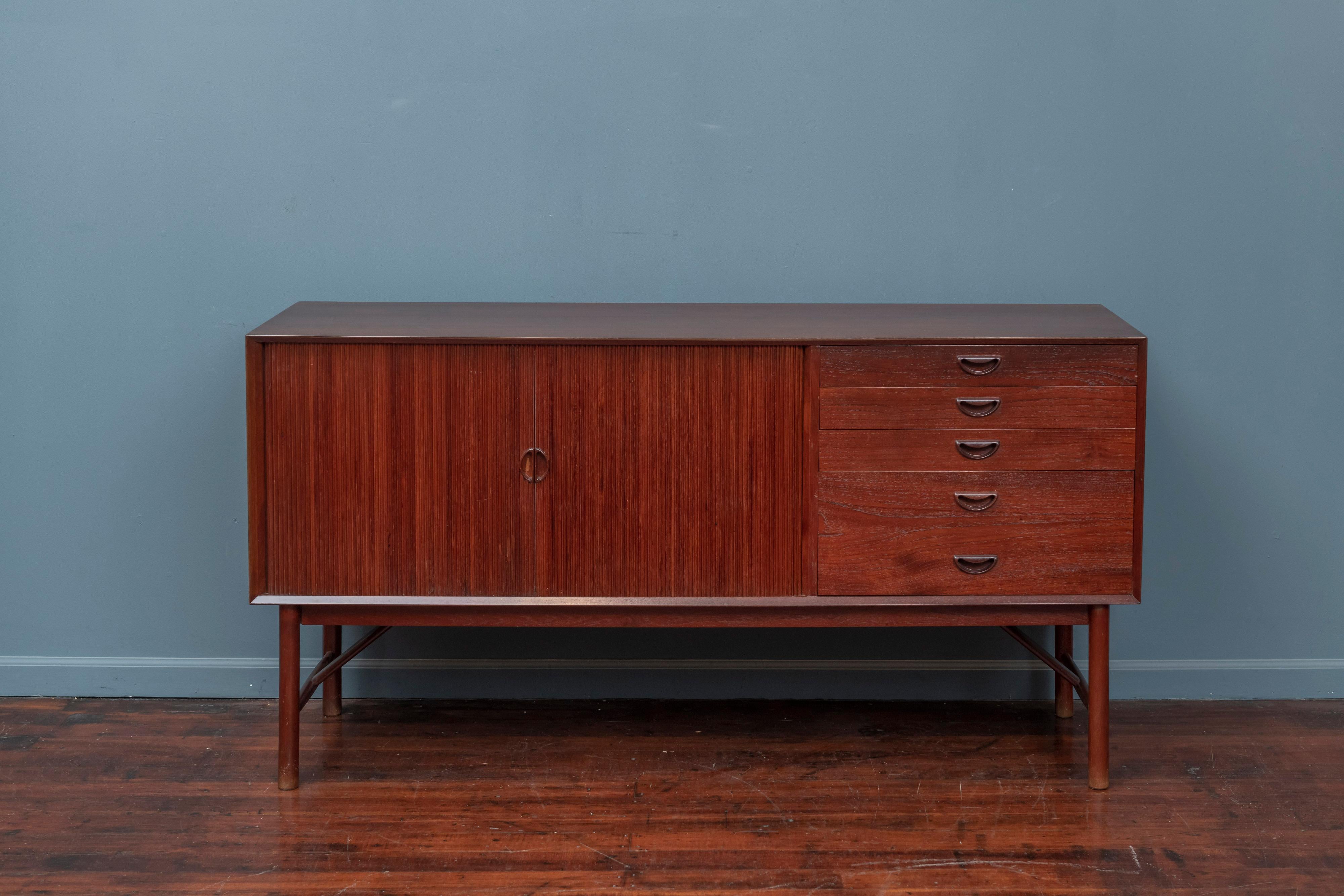 Peter Hvidt & Orla Mølgaard Nielsen design teak credenza, Denmark. High quality solid teak construction and attention to detail, drawers and door move smooth with one adjustable shelf.
 