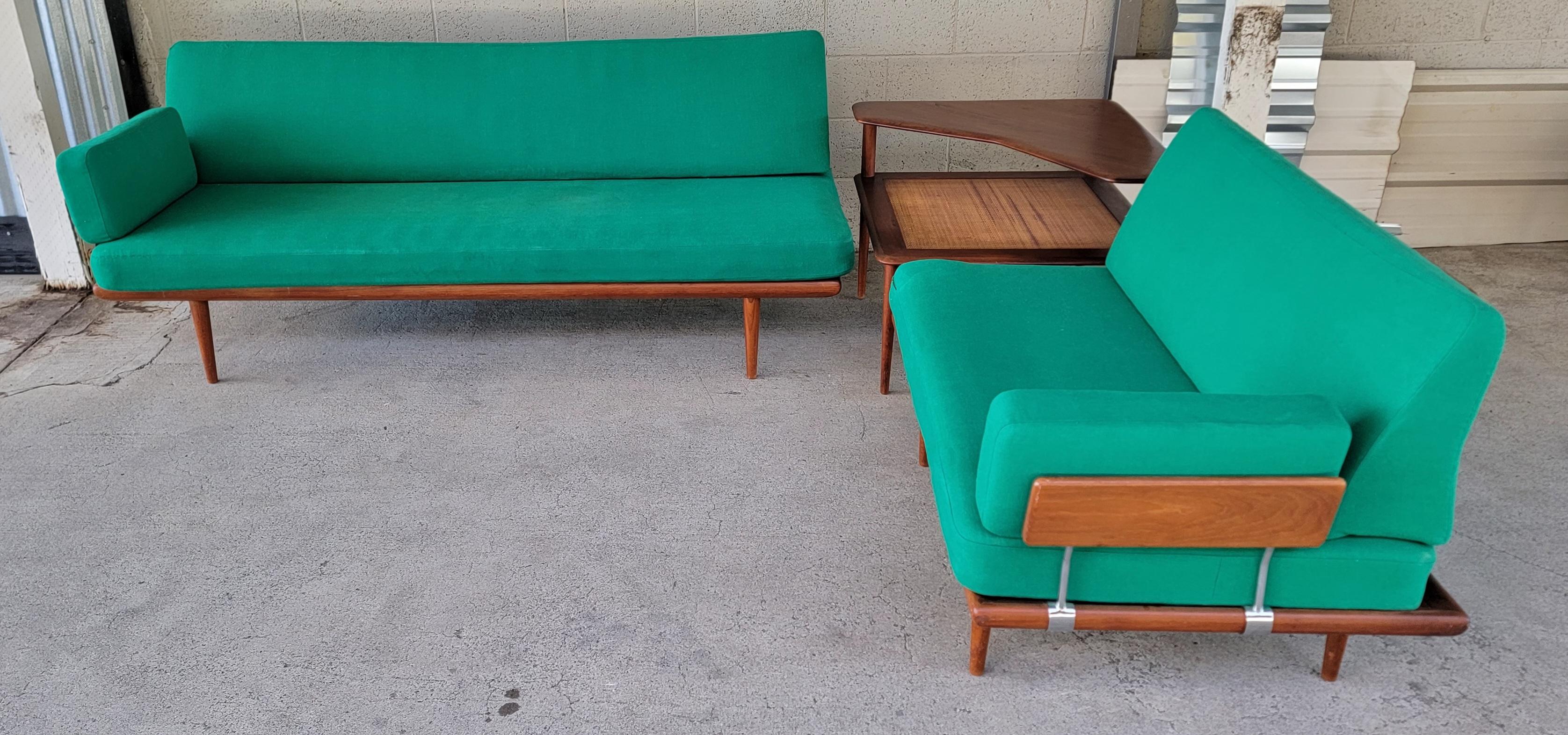 A 3 piece teak Danish Modern sectional sofa set consisting of two sofas and a corner table. Designed by Peter Hvidt & Orla Mølgaard-Nielsen for France and Son. Denmark, circa. 1950's. All pieces crafted in solid teak. Very good original condition
