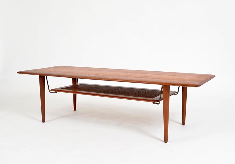 This incredibly stylish solid teak coffee table, model FD-516, was designed in 1956 by Peter Hvidt and Orla Mølgaard-Nielsen for France & Søn, Denmark.
As so typical with Danish design, there are numerous refined details, such as the edges of the