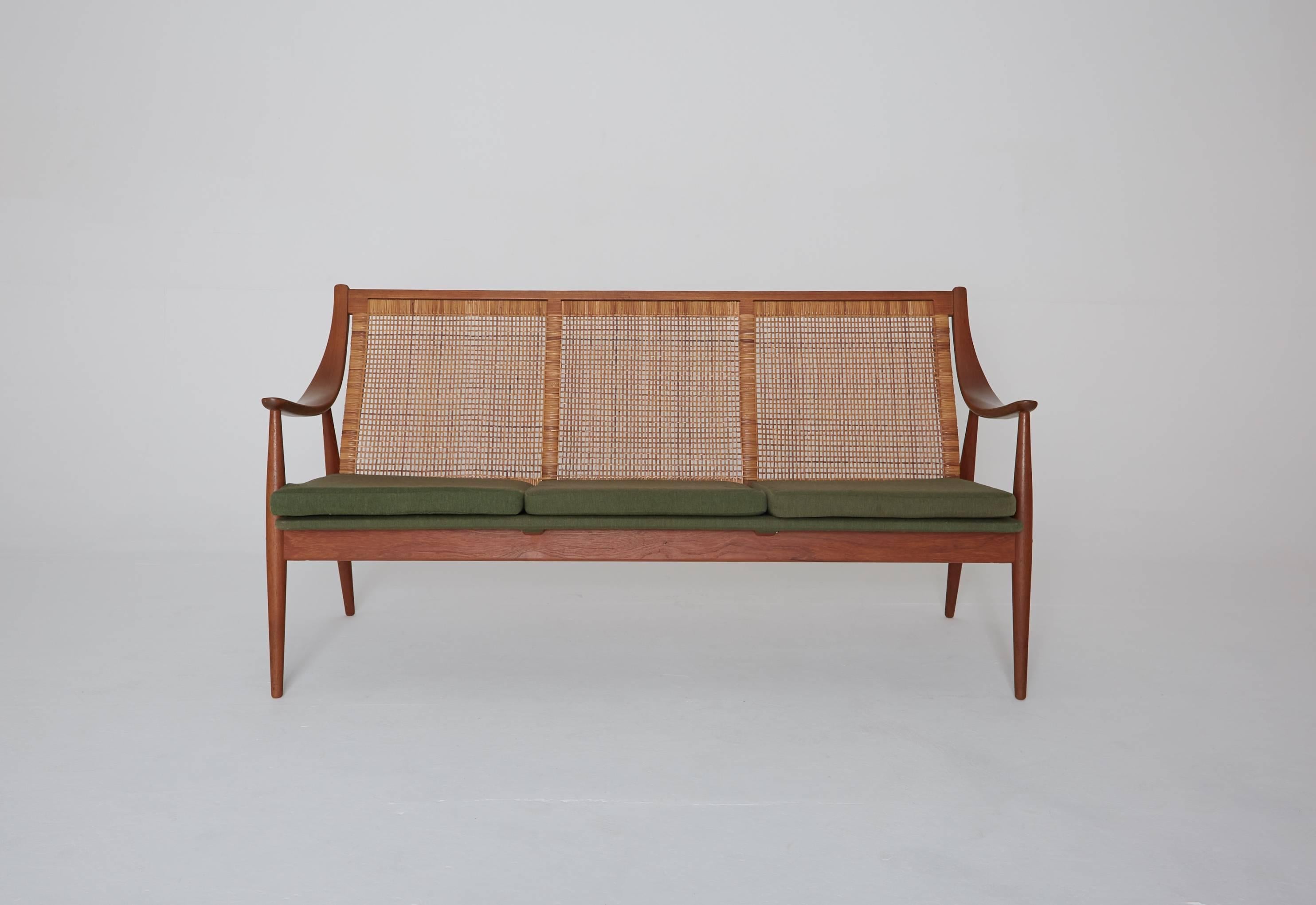 A rare Peter Hvidt & Orla Mølgaard-Nielsen FD 146 sofa, Denmark, 1950s, with original green fabric seat cushions. Matching chair available. Ships worldwide - please contact us for options.