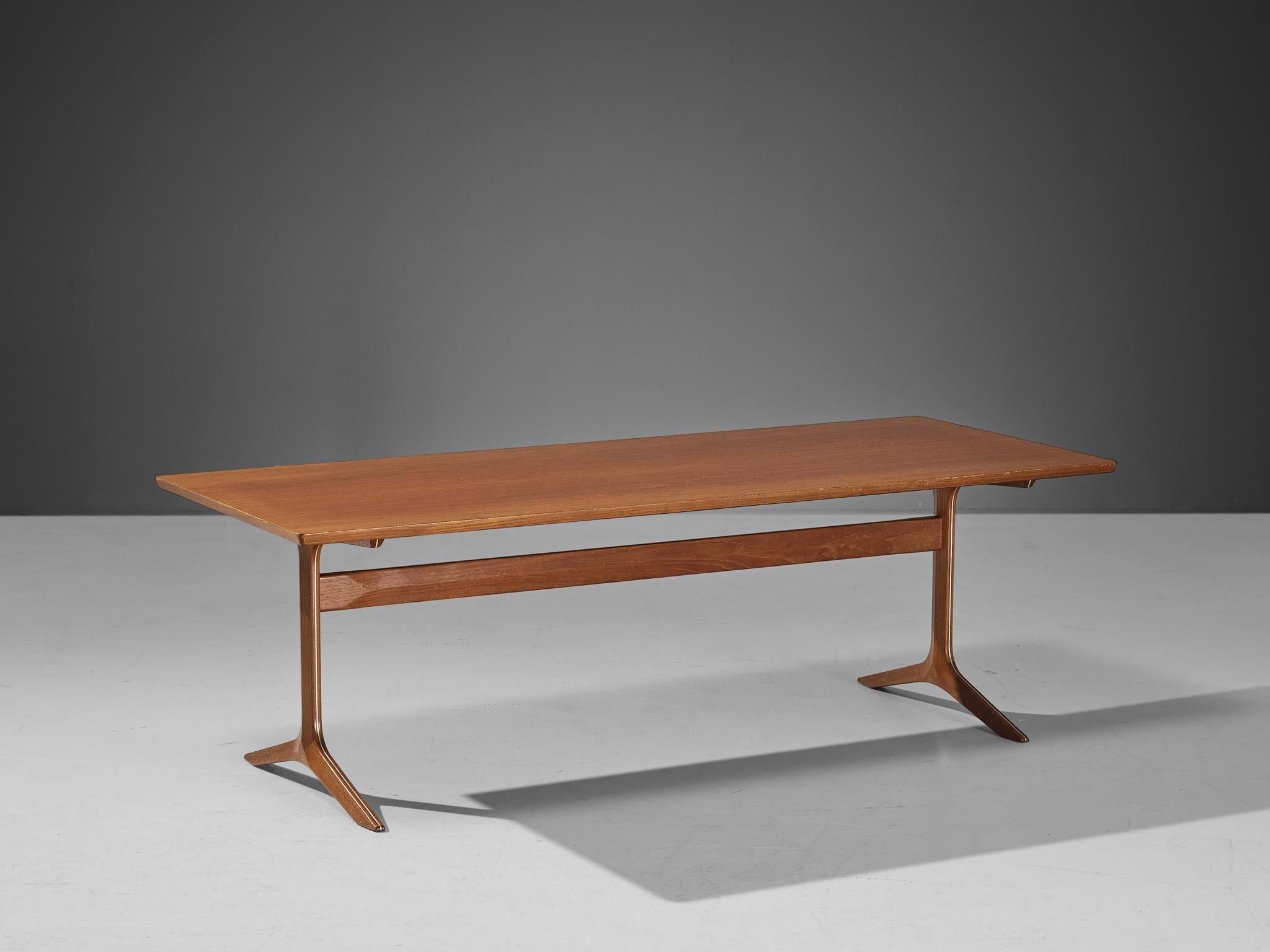 Peter Hvidt & Orla Mølgaard-Nielsen for France & Søn, coffee table, teak, Denmark, 1950s. 

This elegant teak wooden coffee table is created by the Danish designers Peter Hvidt and Orla Mølgaard-Nielsen. It holds the quintessential essence of Danish