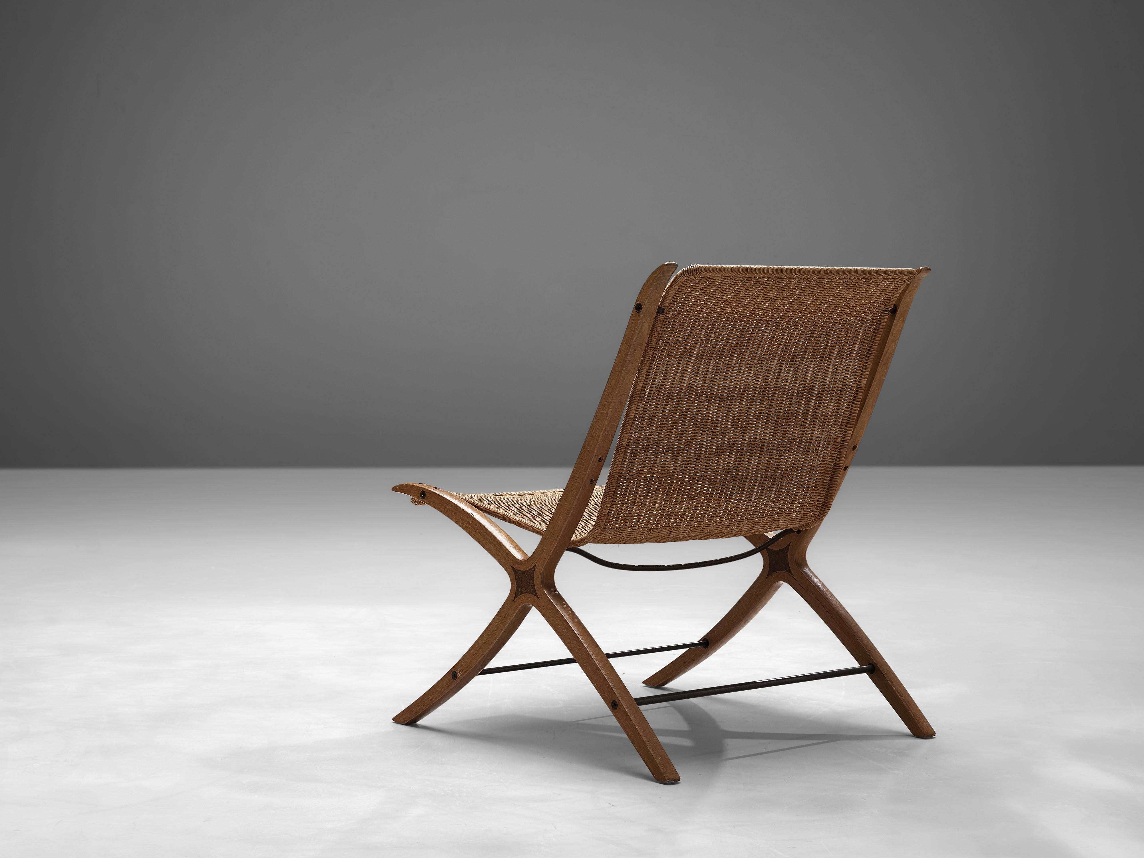 Peter Hvidt & Orla Mølgaard Nielsen for Fritz Hansen, 'X-chair model '6103', cane, maple, mahogany, Denmark, designed in 1958

This chair is for obvious reasons nicknamed the 'X-chair'. The detailing of this X-design runs all the way from the front