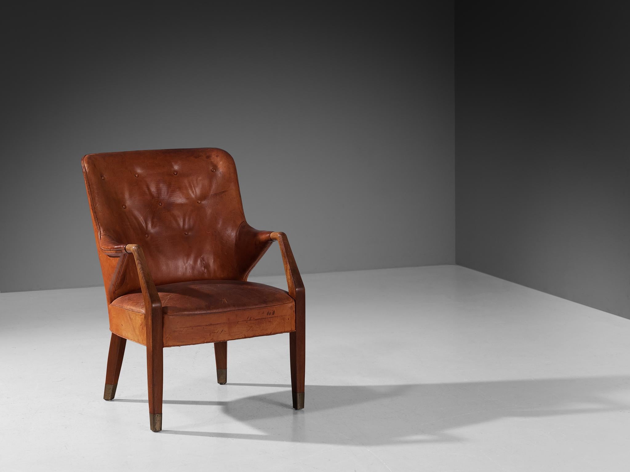 Peter Hvidt & Orla Mølgaard-Nielsen for Gustav Bertelsen, armchair, teak, leather, brass, Denmark, 1948. 

Early designed lounge chair by Danish designer duo Peter Hvidt and Orla Mølgaard-Nielsen. This rare chair has been designed in 1948; a