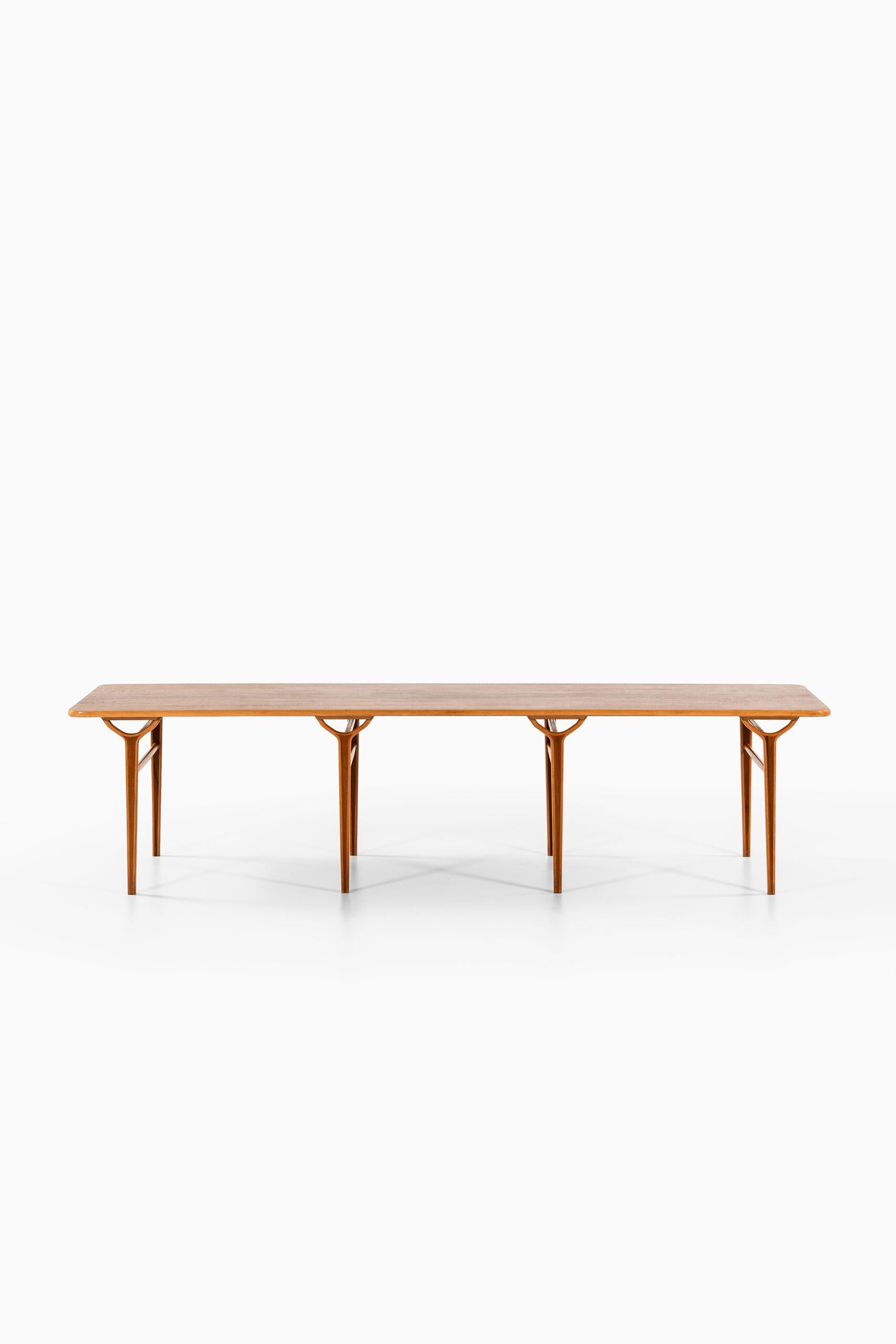 Rare library table designed by Peter Hvidt & Orla Mølgaard-Nielsen. Produced by Fritz Hansen in Denmark.