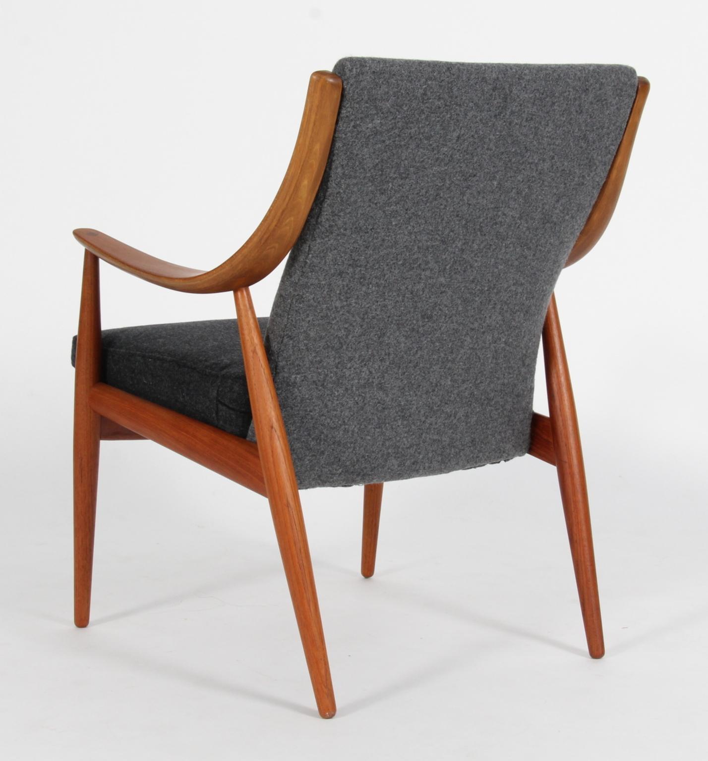 Peter Hvidt & Orla Mølgaard Nielsen lounge chair new upholstered with two-tone Divinia Melange wool.

Frame in teak.

Made by France & Daverkosen.