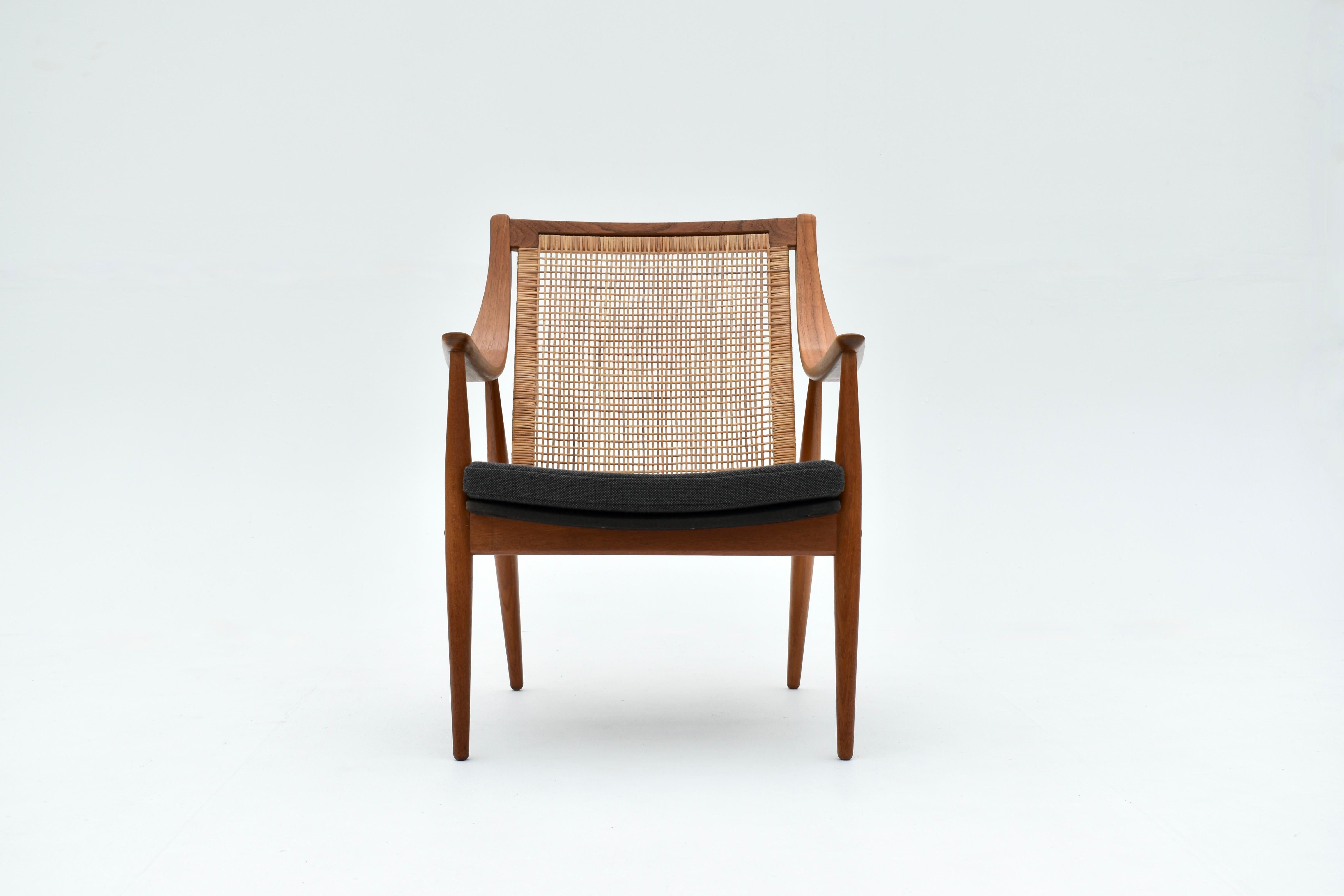 One of our all time favourite designs, the model 147 chair designed by Peter Hvidt & Orla Molgaard Nielsen is one of the most graceful Danish Modern chairs. A combination of very expressive fluid lines to the frame coupled with the rattan backrest