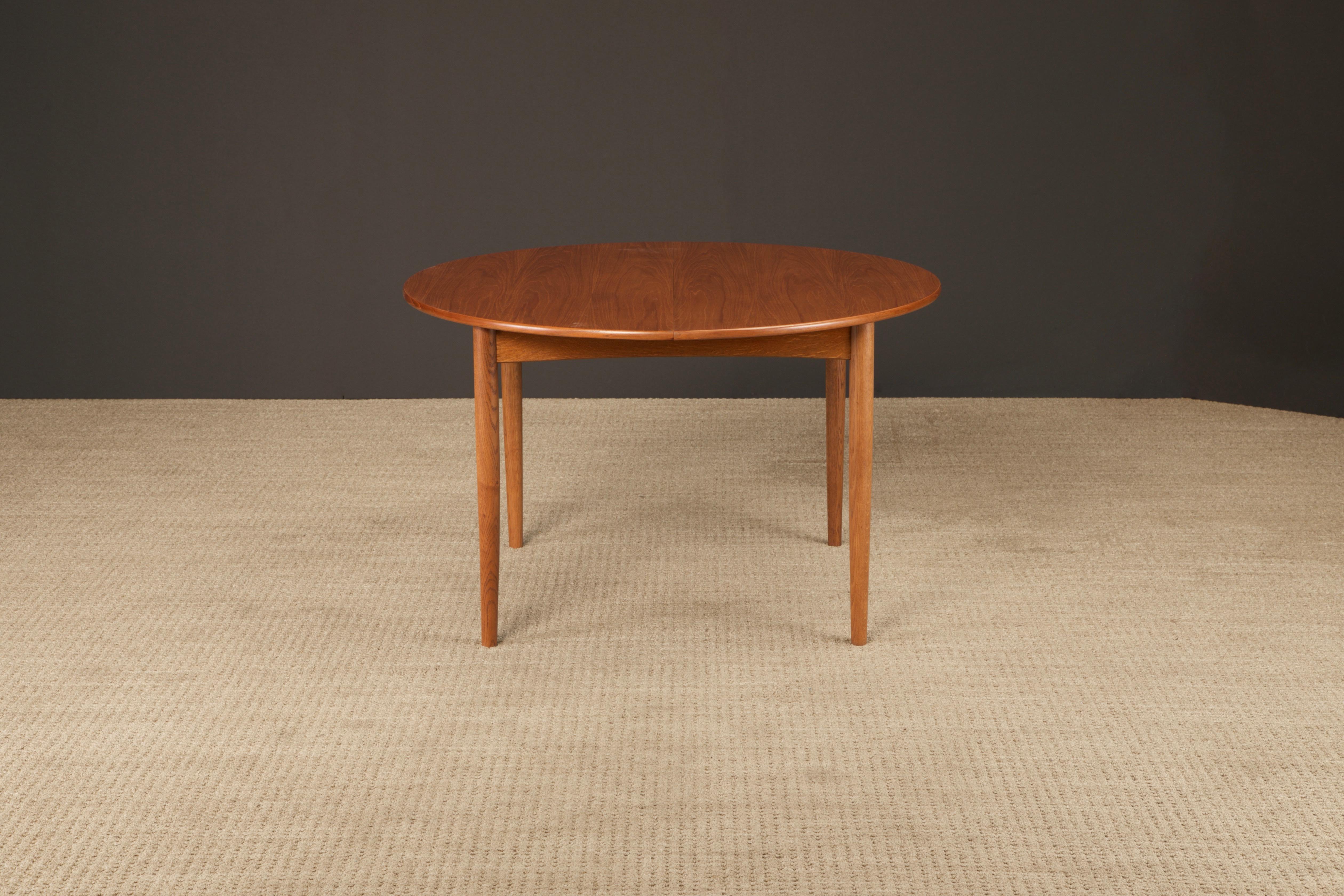 This beautifully refinished Model 311 teak extendable dining table by Peter Hvidt & Orla Mølgaard-Nielsen for Søborg Møbler, designed in 1956, comes with a single leaf and is stamped on the underside of both the table and the leaf.  Features an