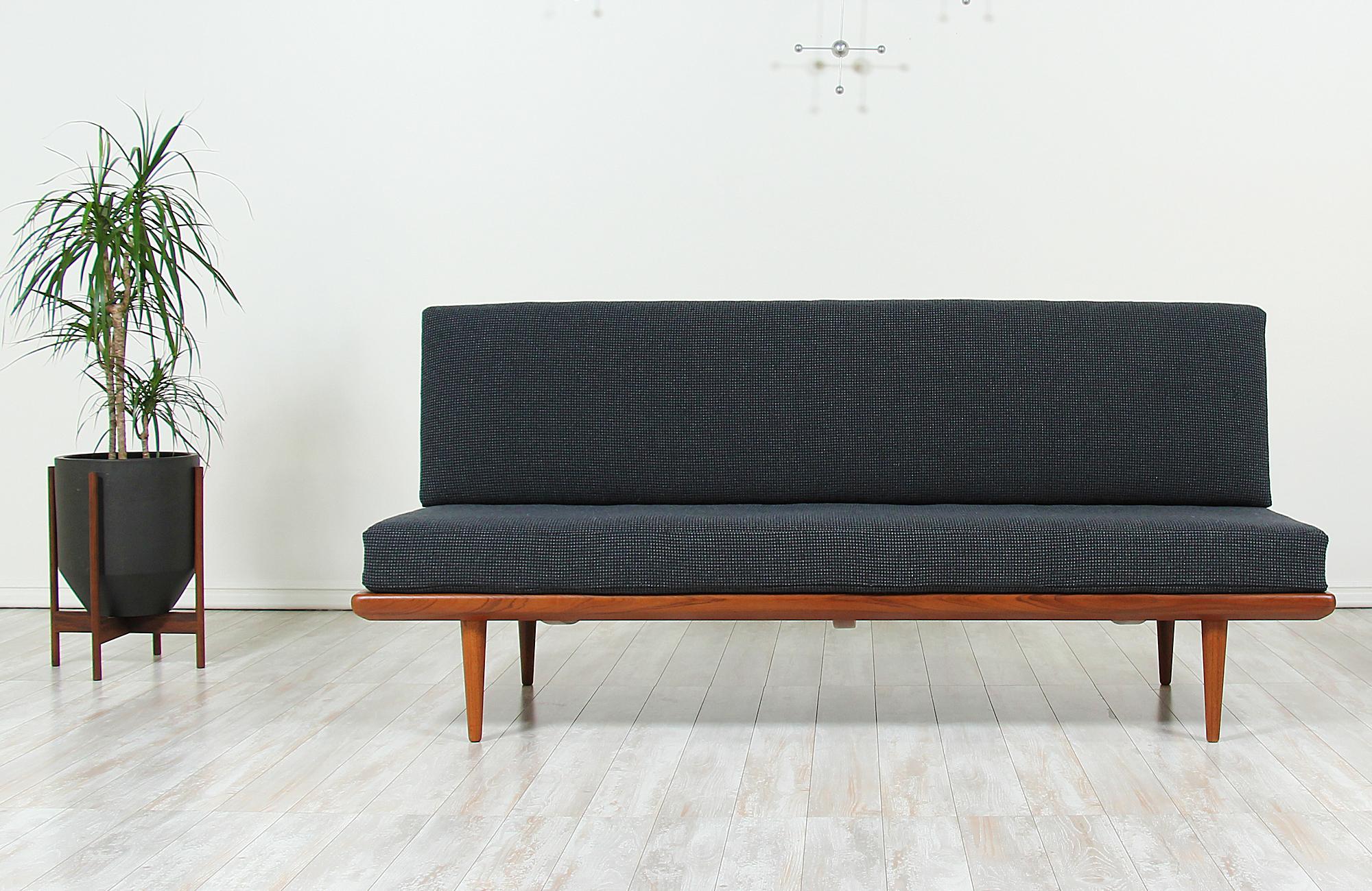 Fabulous model FD-417 sofa designed by the iconic duo, Peter Hvidt & Orla Mølgaard-Nielsen, for France & Daverkosen in Denmark, circa 1950s. This beautiful sofa features new high-density foam upholstered in a tasteful charcoal grey fabric. The dark