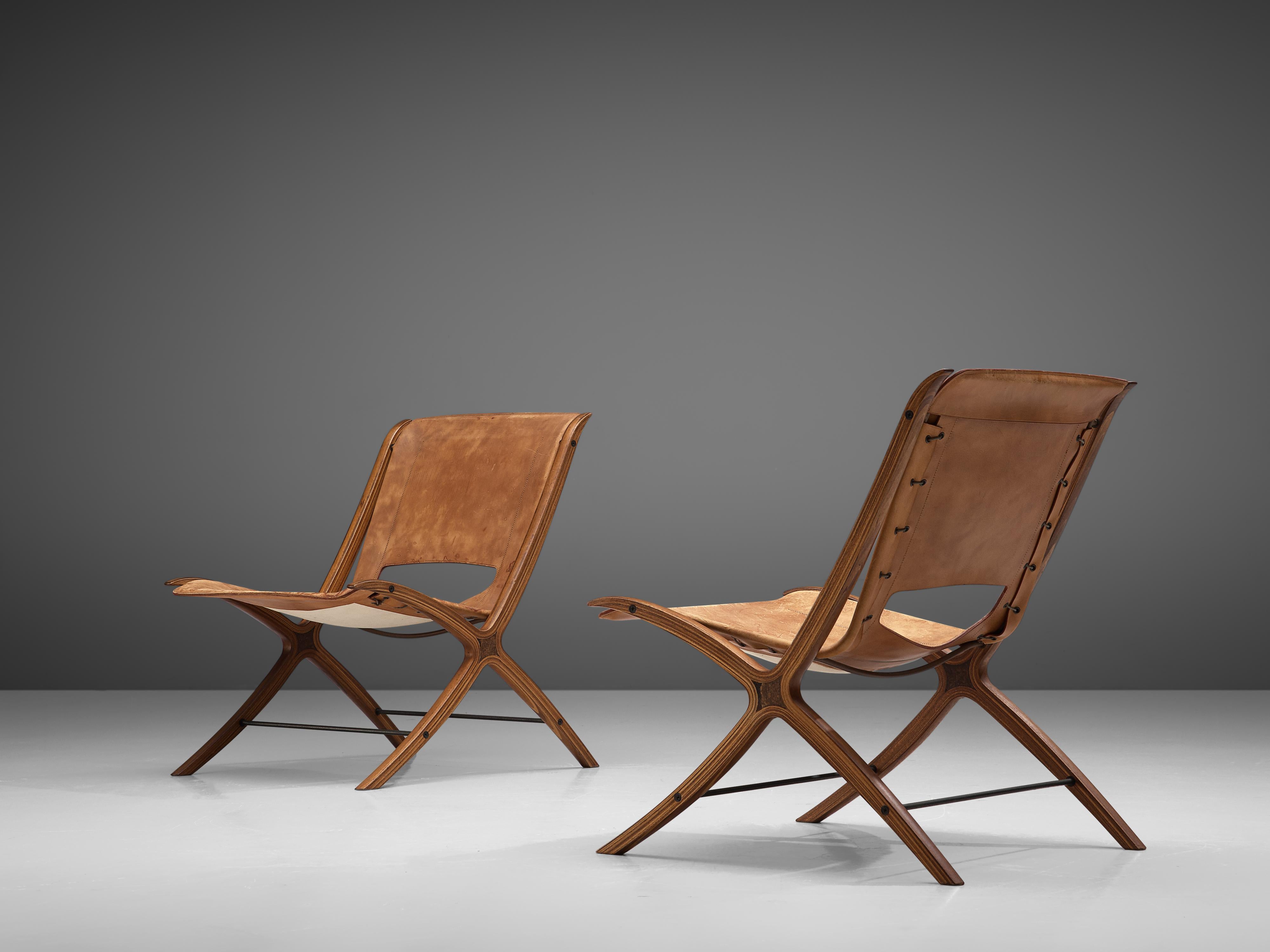 Peter Hvidt & Orla Mølgaard Nielsen for Fritz Hansen, pair of X-chairs 'model 6103', original cognac leather upholstery, mahogany and burlwood, Denmark, 1958.

This pair of chairs designed by Peter Hvidt and Orla Mølgaard Nielsen is for obvious