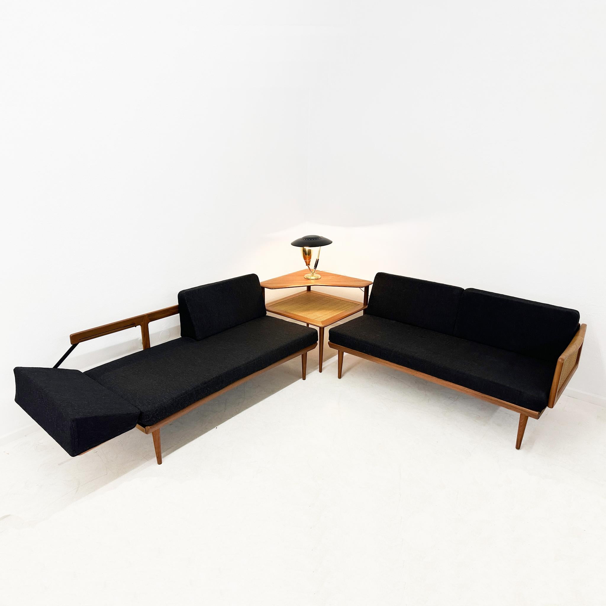 Modular living room set  designed by the Danish architects Peter Hvidt & Orla Mølgaard Nielsen. It was produced in Denmark by France & Daverkosen during the 1950's. The set includes two modular 2-seater sofa and a corner coffee table model FD 519.