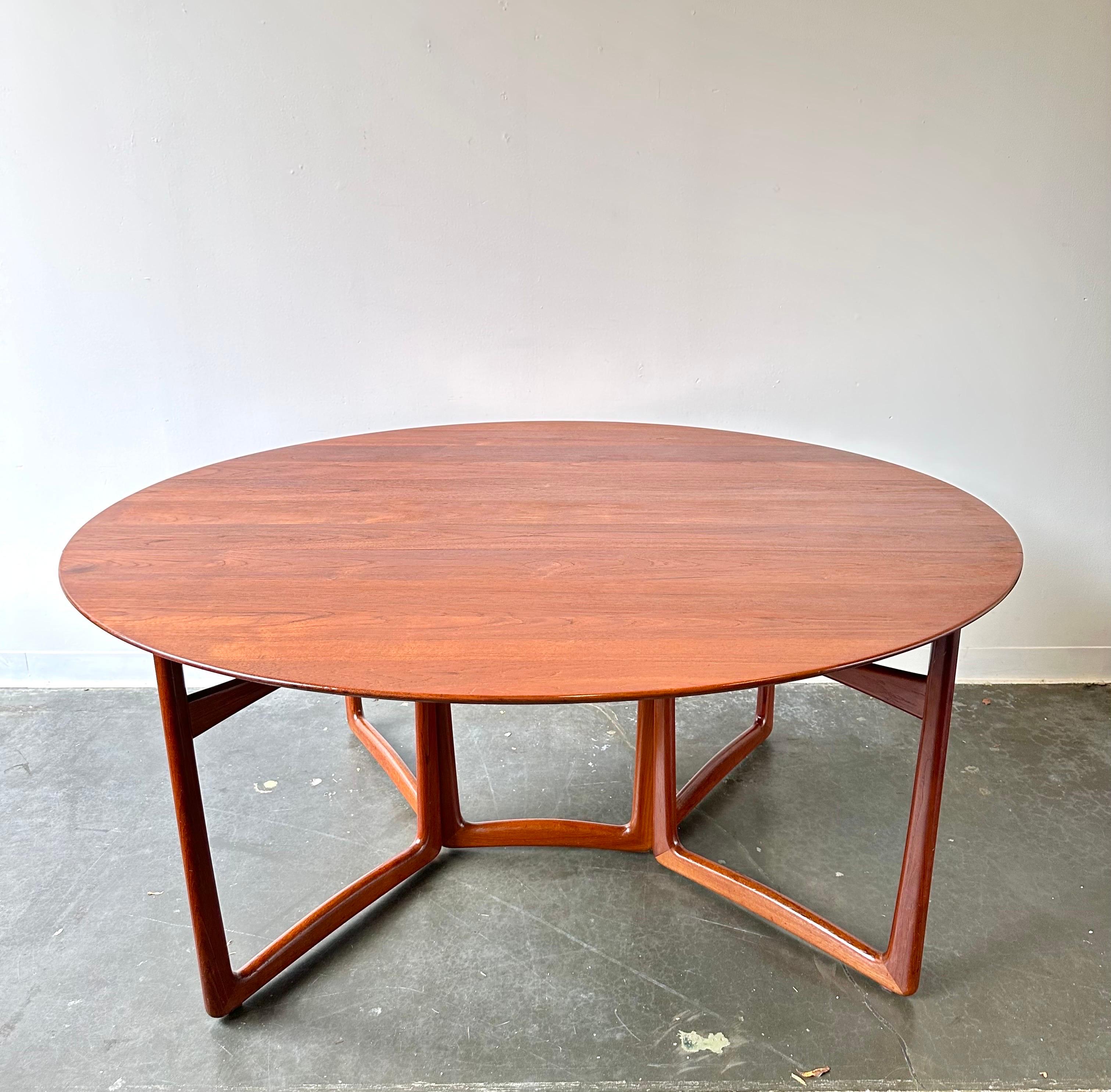 France & Son Teak Drop Leaf Dining Table Designed by Peter Hvidt & Orla Mølgaard Nielsen.

Gorgeous collectors dining table with a refinished top.
Collapsable table that makes the perfect space saver.

Open: 64ʺ L × 58ʺ D × 28 1/2ʺ H
Closed: 64