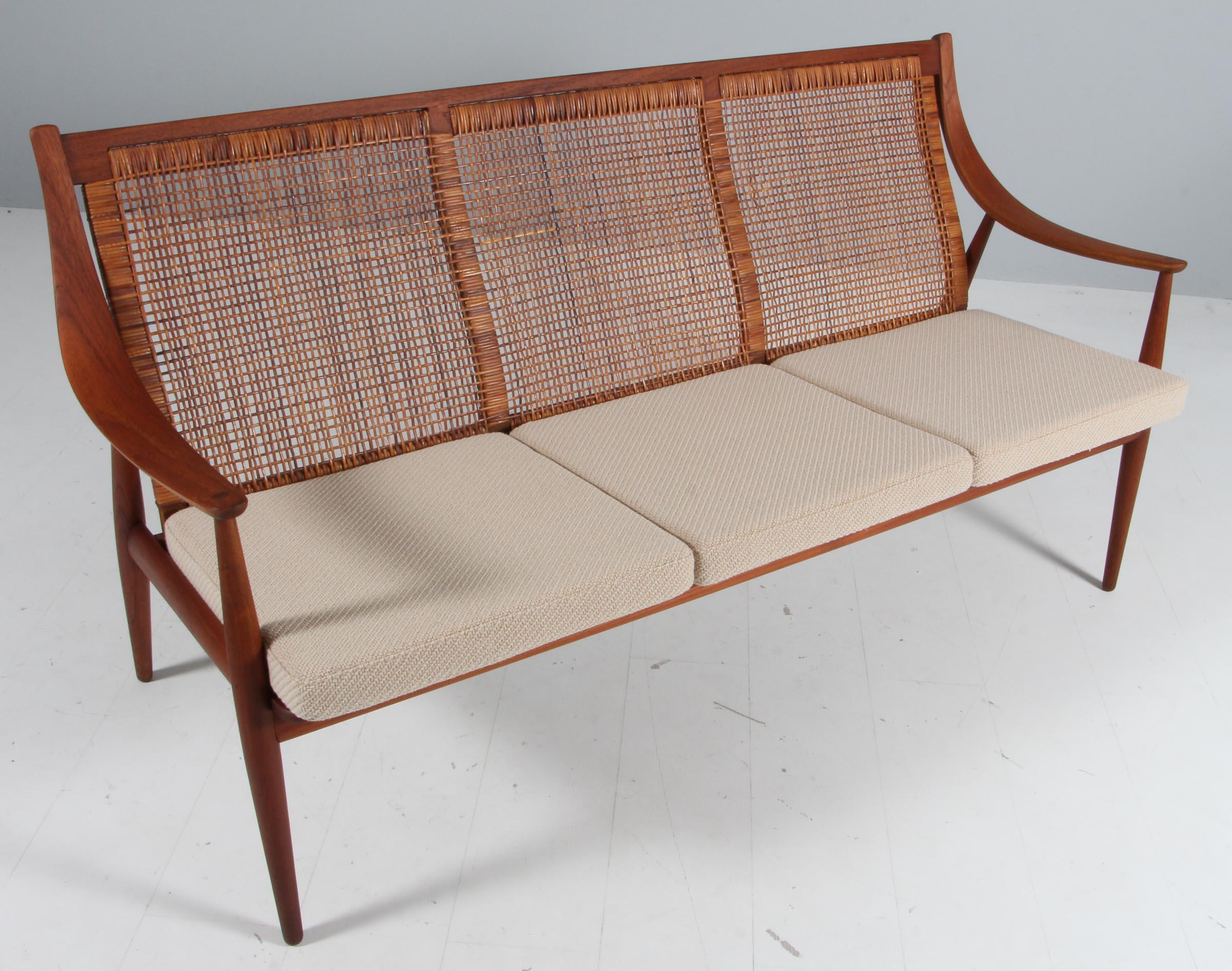 Peter Hvidt & Orla Mølgaard Nielsen three seat sofa with back of cane. New upholstered with Coda fabric from Kvadrat.

Frame in teak and oak.

Made by France & Daverkosen.