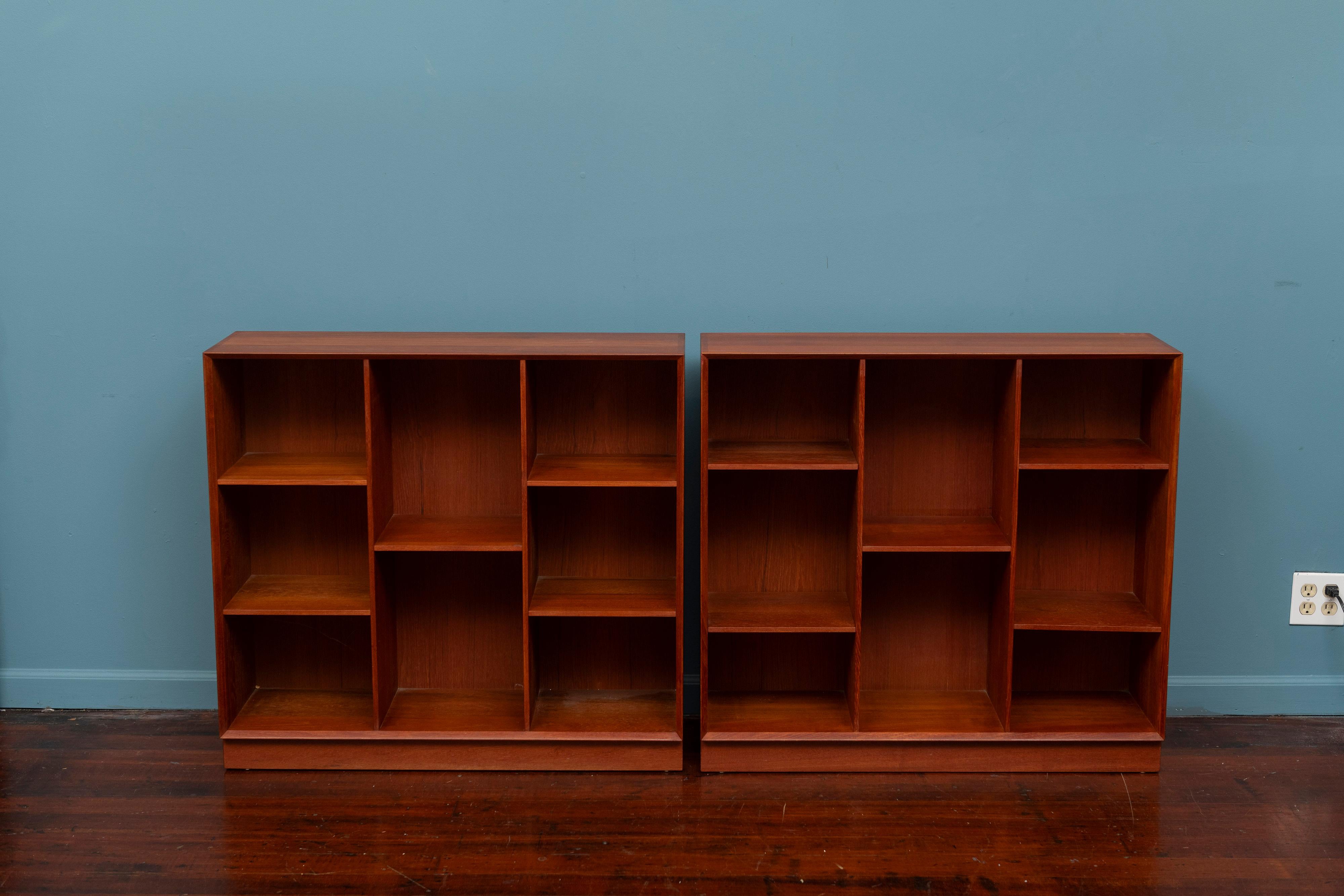 Pair of Peter Hvidt & Olga Molegaard design bookcases, Denmark. Made from high quality materials and construction techniques, featuring adjustable shelves on plinth bases. Box tail joinery at the corners and mitered edges. Newly refinished and ready