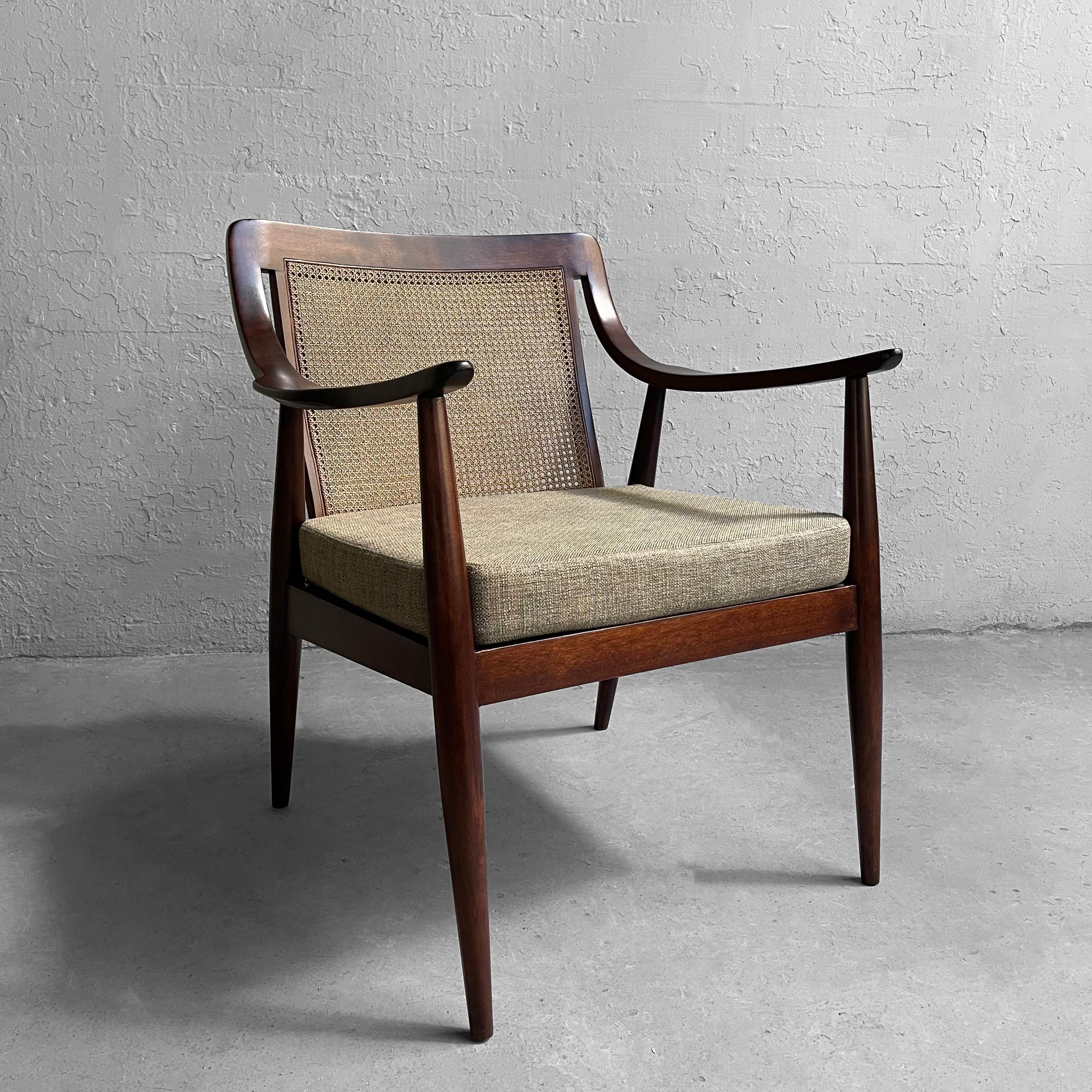Danish modern armchair by Peter Hvdit & Orla Molgaard features a walnut frame with scoop arms, cane back and light green tweed upholstered seat.