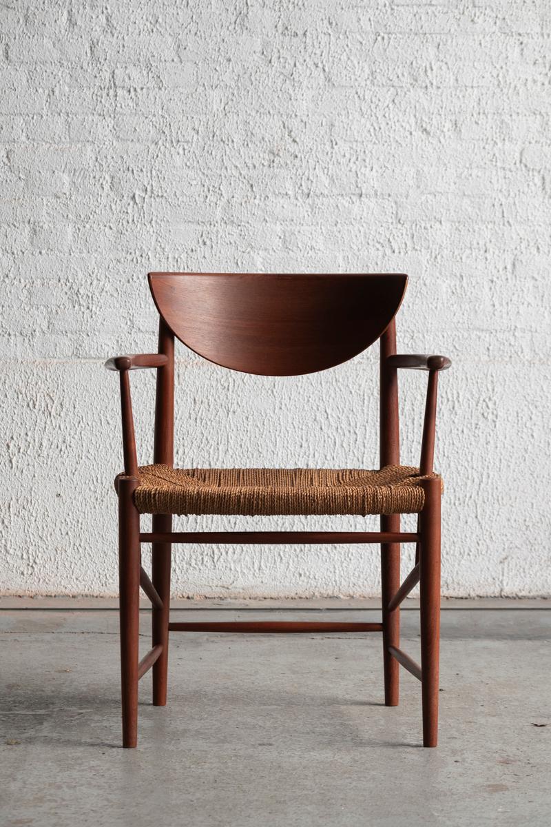 Armchair ‘model 317’, designed by Peter Hvidt and Orla Molgaard Nielsen and produced by Soborg Mobelfabrik in Denmark in the 1950’s. The solid teak wooden frame and original cord seatings have a very nice patina. In very good condition, with some