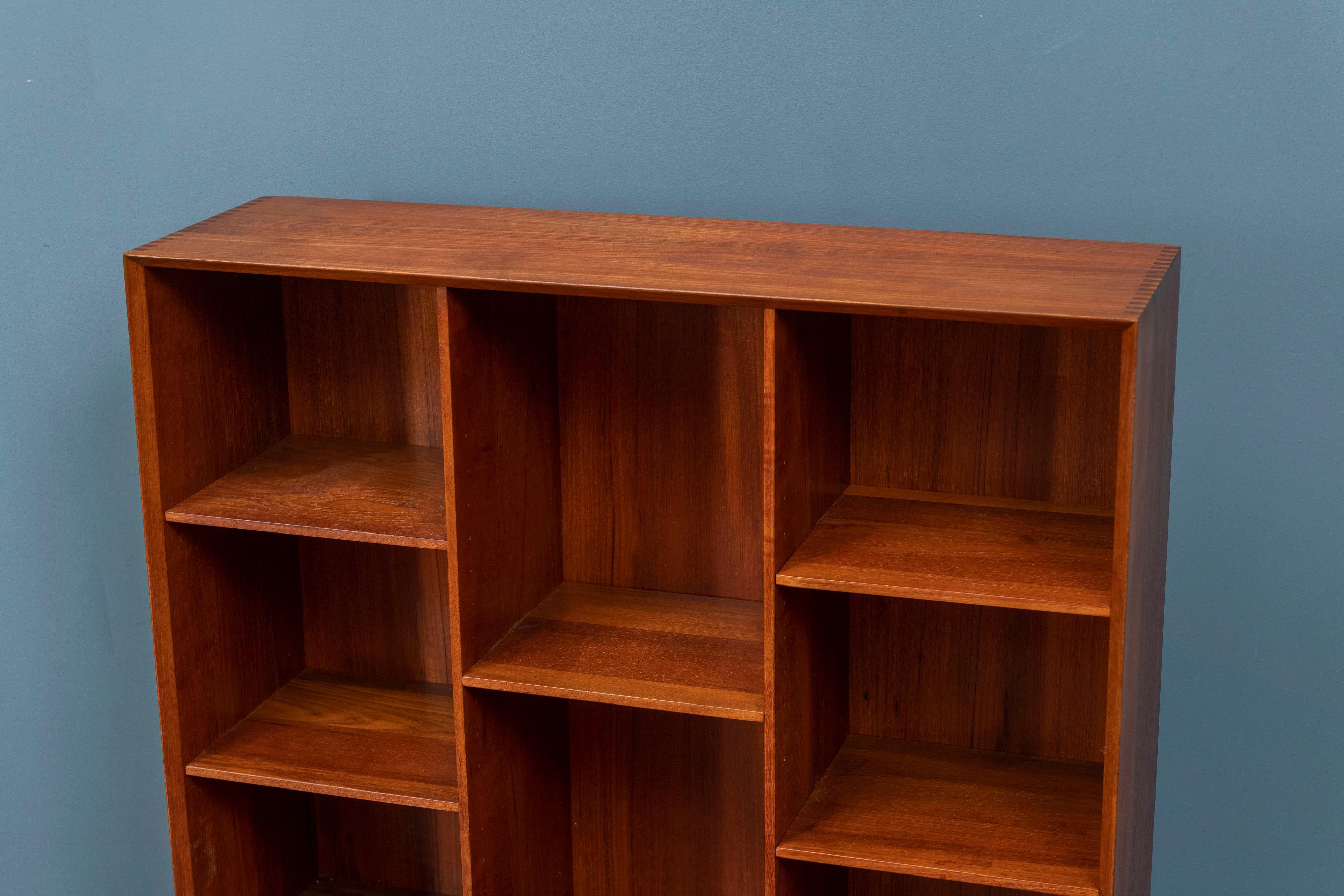 Peter Hvidt & Orla Molegaard Nielsen design teak bookcase with five adjustable shelves, signed. High quality construction and newly refinished.
