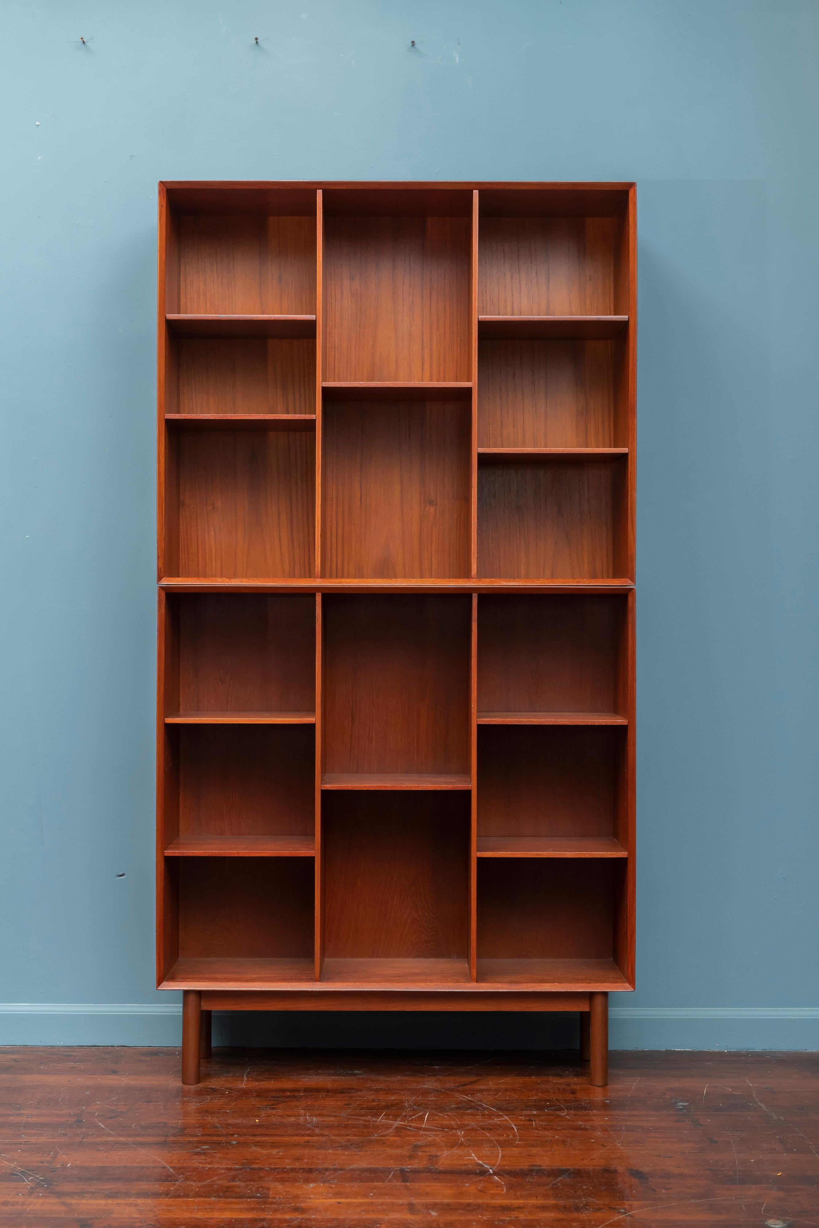 Peter Hvidt & Orla Mølgaard Nielsen teak two piece bookcase with adjustable shelves, newly restored. Two of the shelves are new replacements.