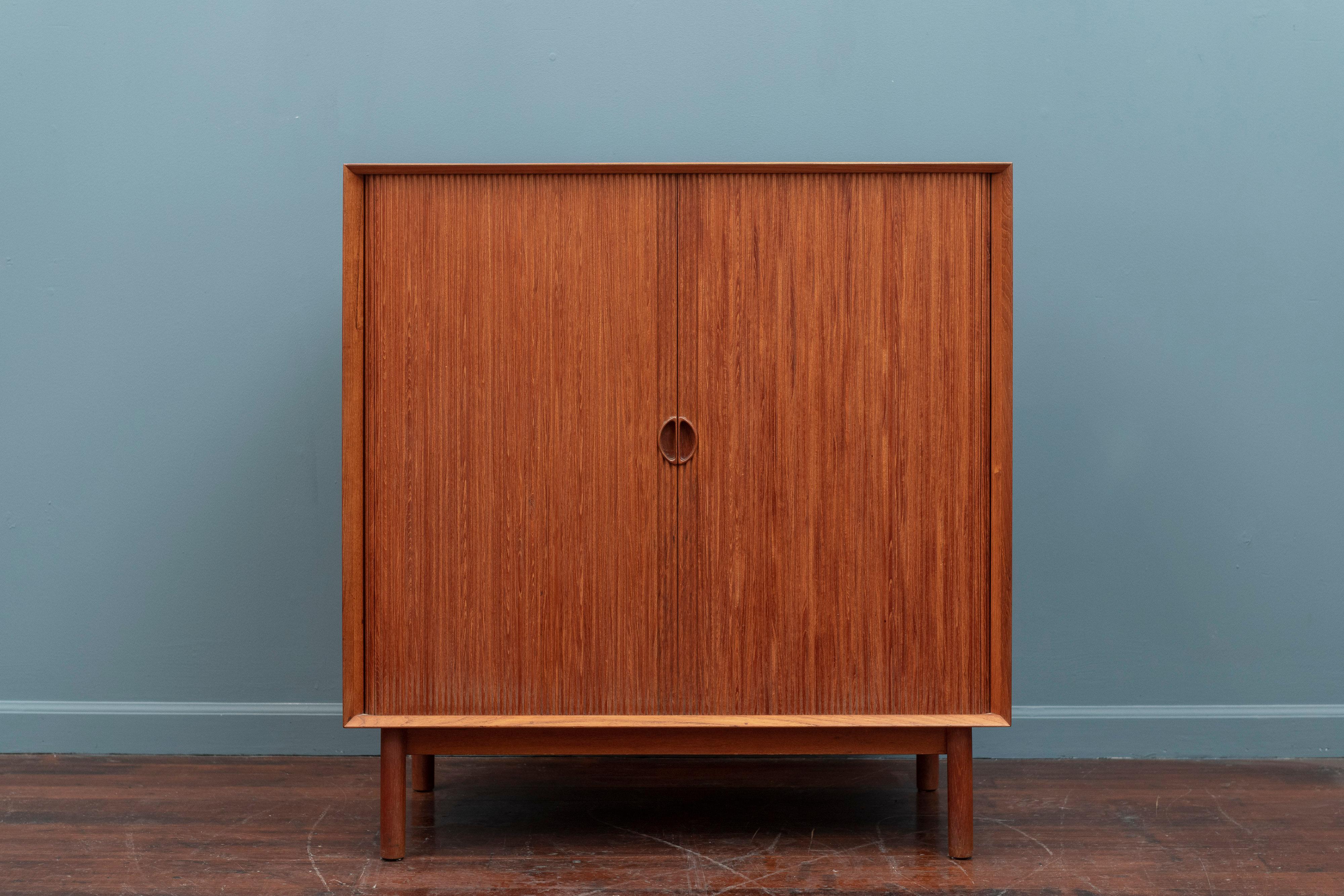 Peter Hvidt & Orla Molgaard Nielsen teak cabinet made from solid teak with a tambour door. High quality construction and design details, stamped.