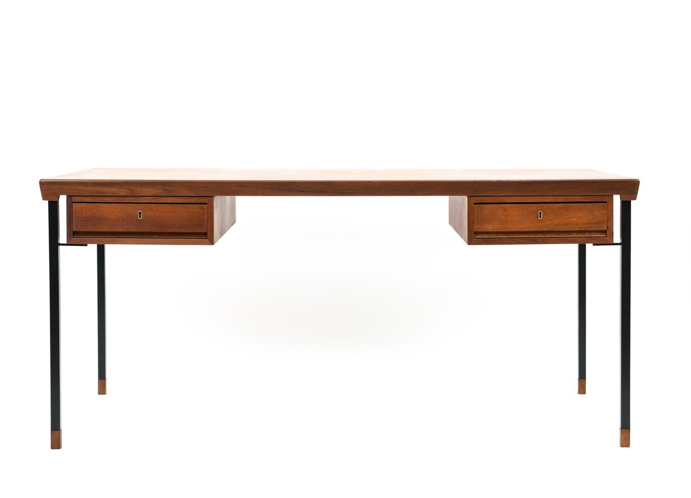 This fabulous Danish teak midcentury writing desk was the result of a collaborative design effort by Peter Hvidt and Orla Molgaard-Nielsen for Soborg Mobelfabrik, circa 1950s. Like Hvidt and Molgaard's other collaborations, this desk features steel