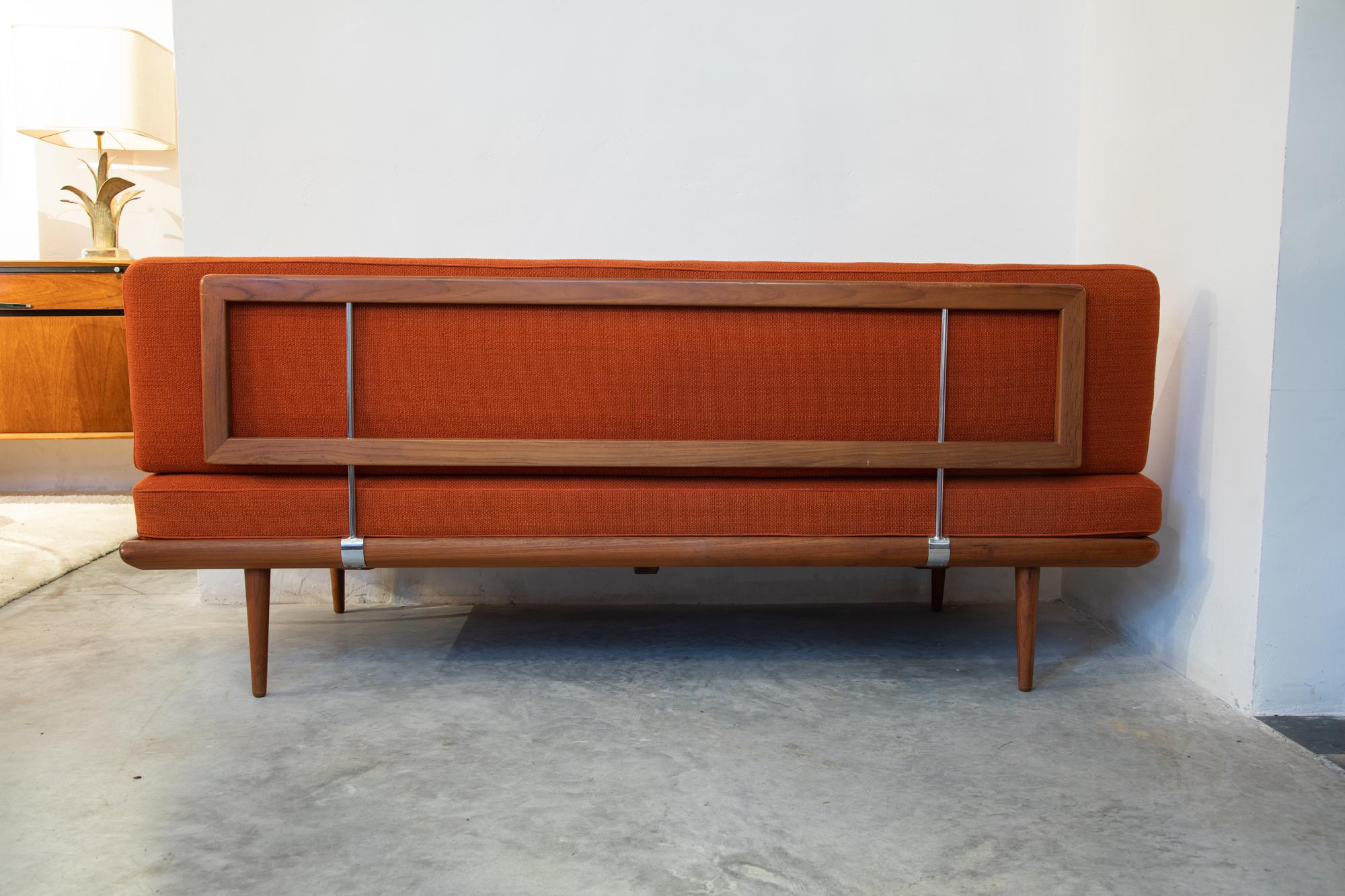 Midcentury Danish daybed in teak wood with slats and chrome accents. 
Original orange woven wool upholstery and comfortable spring mattress.
Minimalistic daybed/sofa model FD 417 'Minerva' by Peter Hvidt & Orla Mølgaard Nielsen for France & Son,