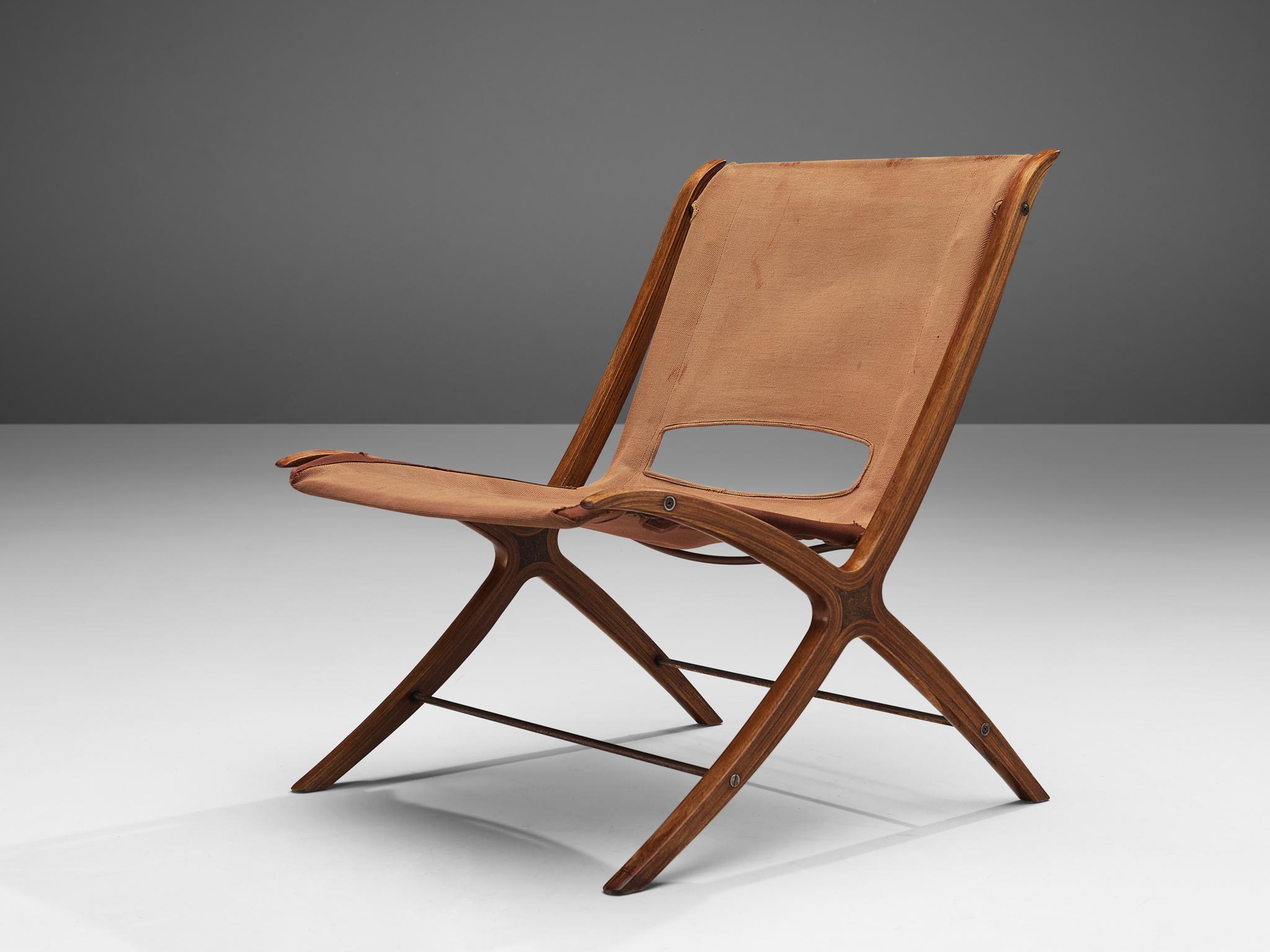 Peter Hvidt & Orla Mølgaard Nielsen ‘X’ lounge chair, model '6103', canvas, mahogany, burlwood, metal, Denmark, 1958.

Crafted in 1958, the present X lounge chair is a creation of the esteemed Danish duo, Peter Hvidt and Orla Mølgaard Nielsen.