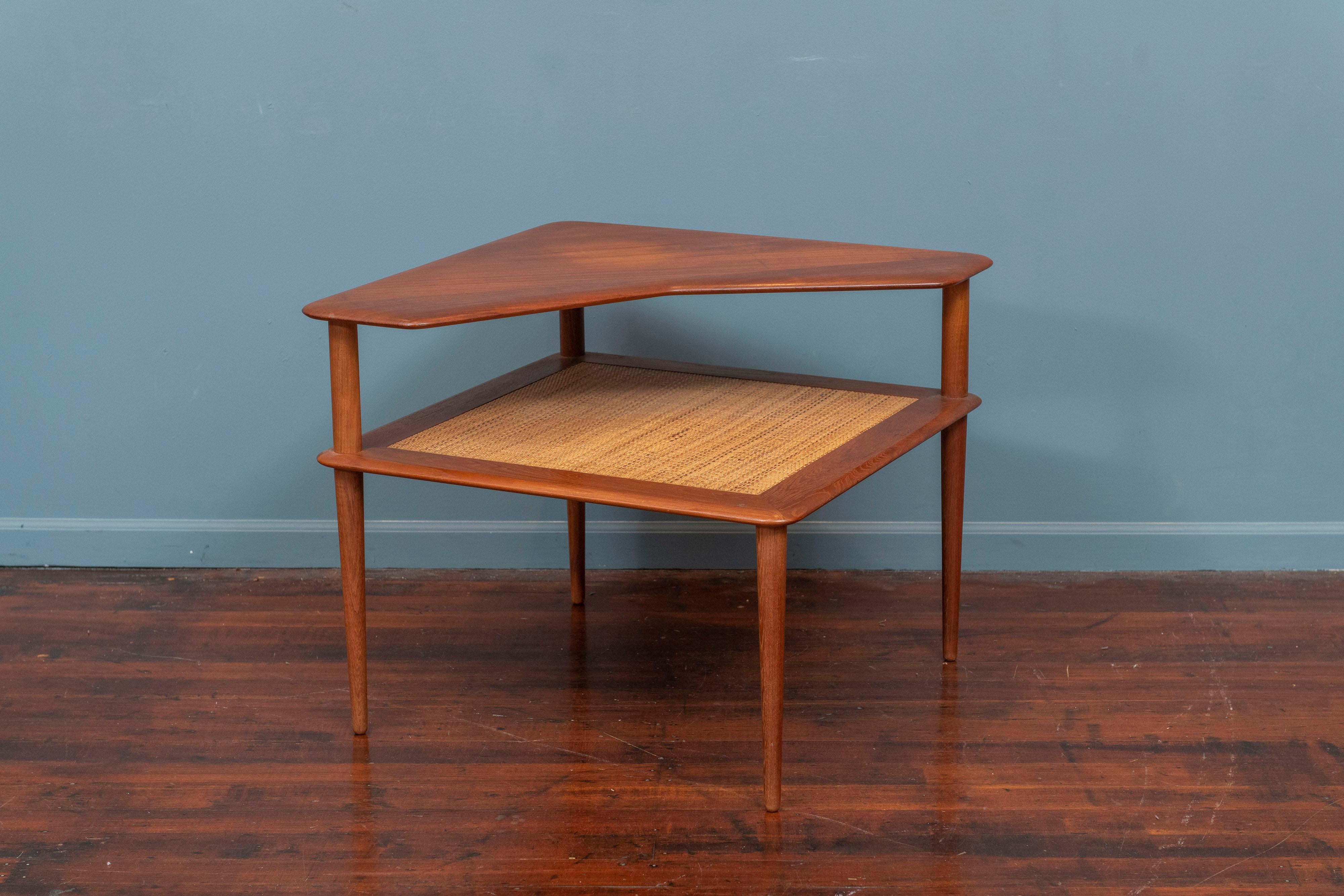 Peter Hvidt & Orla Moregaard design teak two tiered corner table with a cane insert. Very good condition ready to install, labeled.