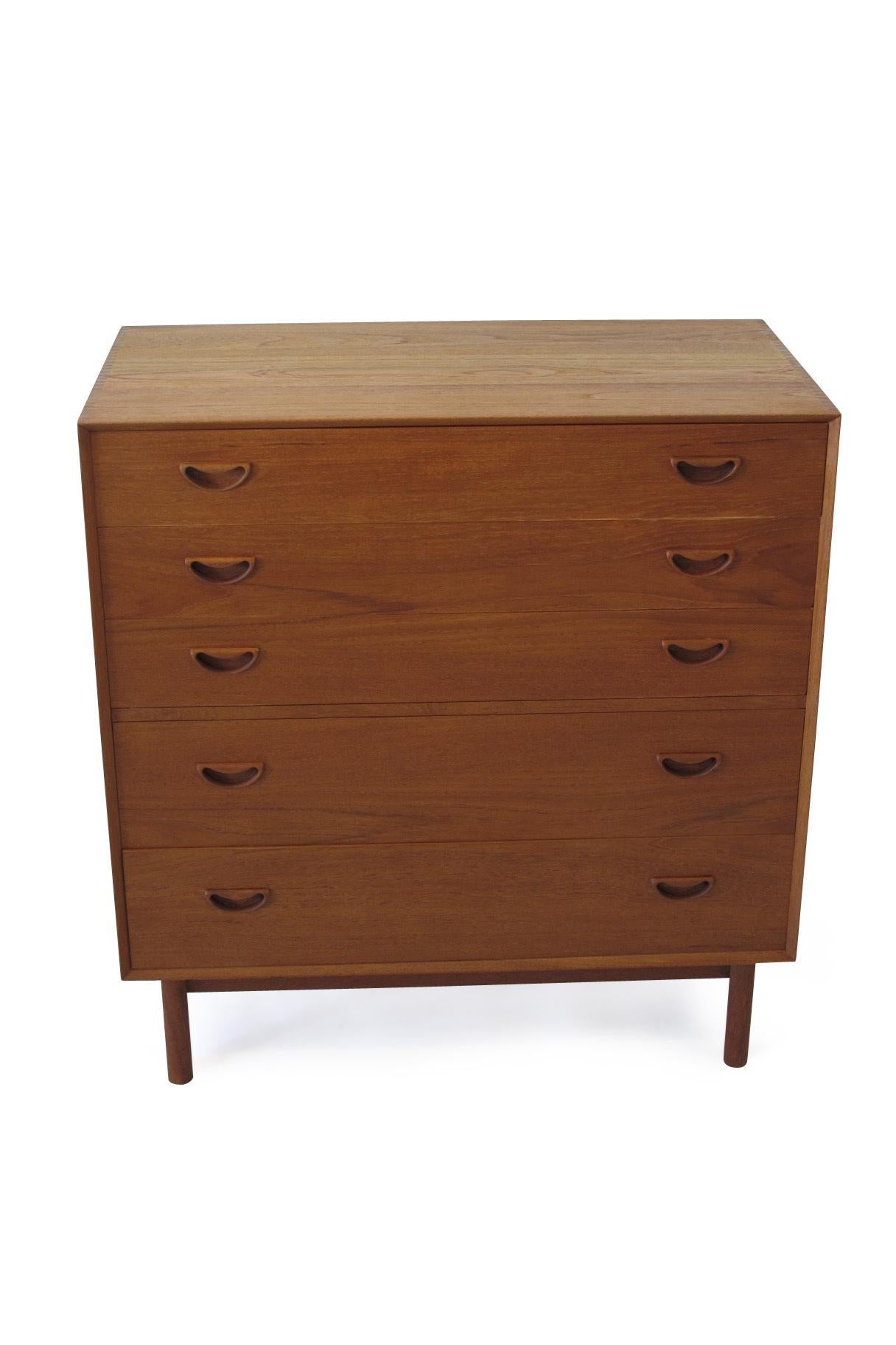 Midcentury six-drawer dresser designed by Peter Hvidt & Orla Molgaard Nielsen Model 301, Denmark. Crafted of solid teak with exposed joinery and sculptural pulls, raised on teak legs. Professionally restored and in excellent condition.