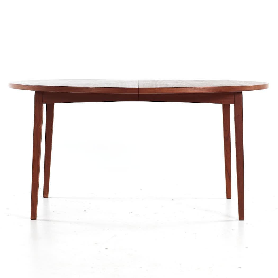 Peter Hvidt Style Mid Century Danish Expanding Teak Dining Table with 2 Leaves

This table measures: 59 wide x 47.25 deep x 28.5 inches high, with a chair clearance of 27.25 inches, each leaf measures 19.75 inches wide, making a maximum table width