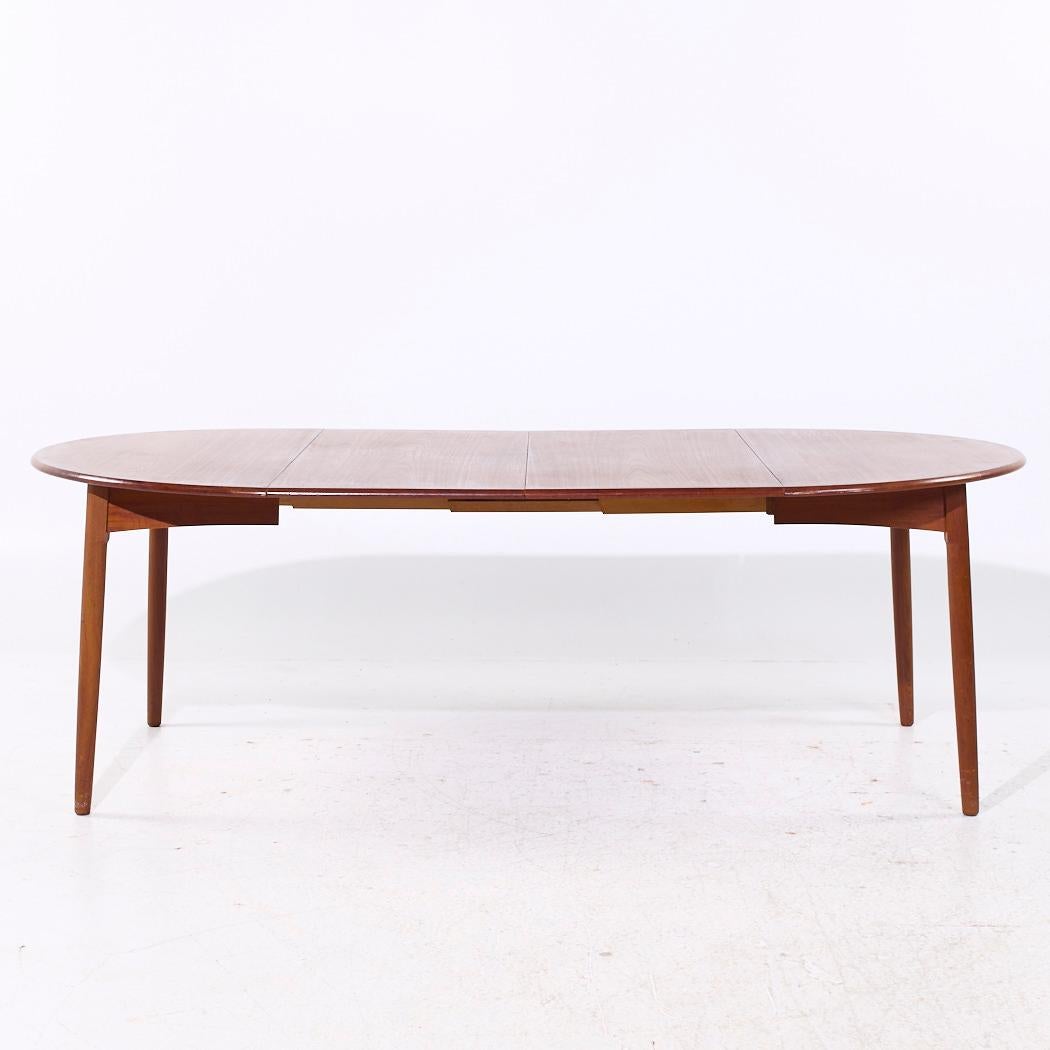 Mesa de comedor extensible de teca danesa de mediados de siglo, estilo Peter Hvidt, con 2 hojas

Esta mesa mide 47 de ancho x 47 de fondo x 28,75 pulgadas de alto, con un espacio libre para sillas de 28 pulgadas, cada hoja mide 20,25 pulgadas de