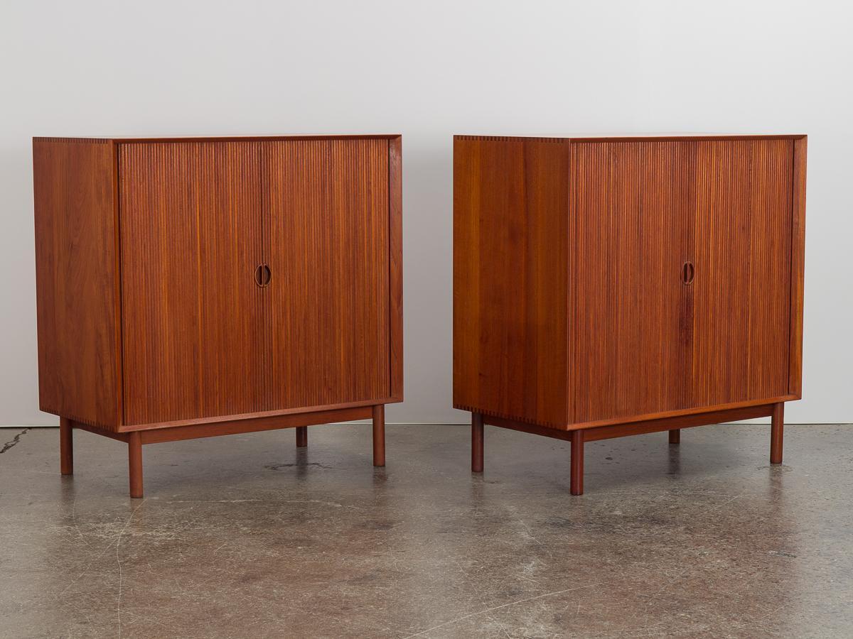 Pair of Danish modern server cabinets with tambour doors, designed by Peter Hvidt & Orla Mølgaard-Nielsen for Soborg. Tambour doors slide smoothly to reveal adjustable shelves at the interior. Cabinets boast exceptional craftsmanship, finished with