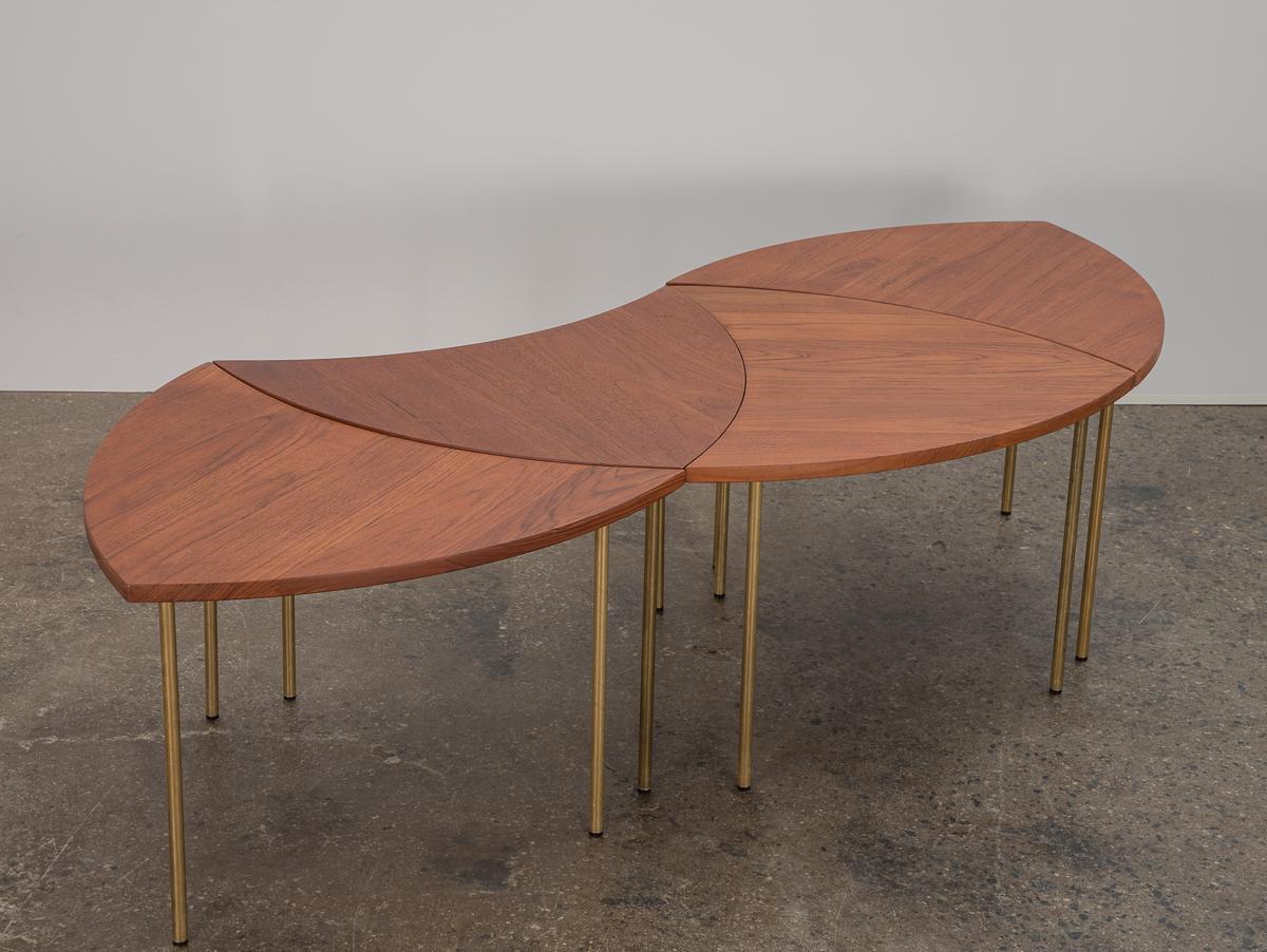 Set of four Model 523 tables, designed by Peter Hvidt and Orla Mølgaard-Nielsen for France and Son. The clever nesting design allows for the tables to be used as singular side tables, or configured into a coffee table arrangement. Tables are