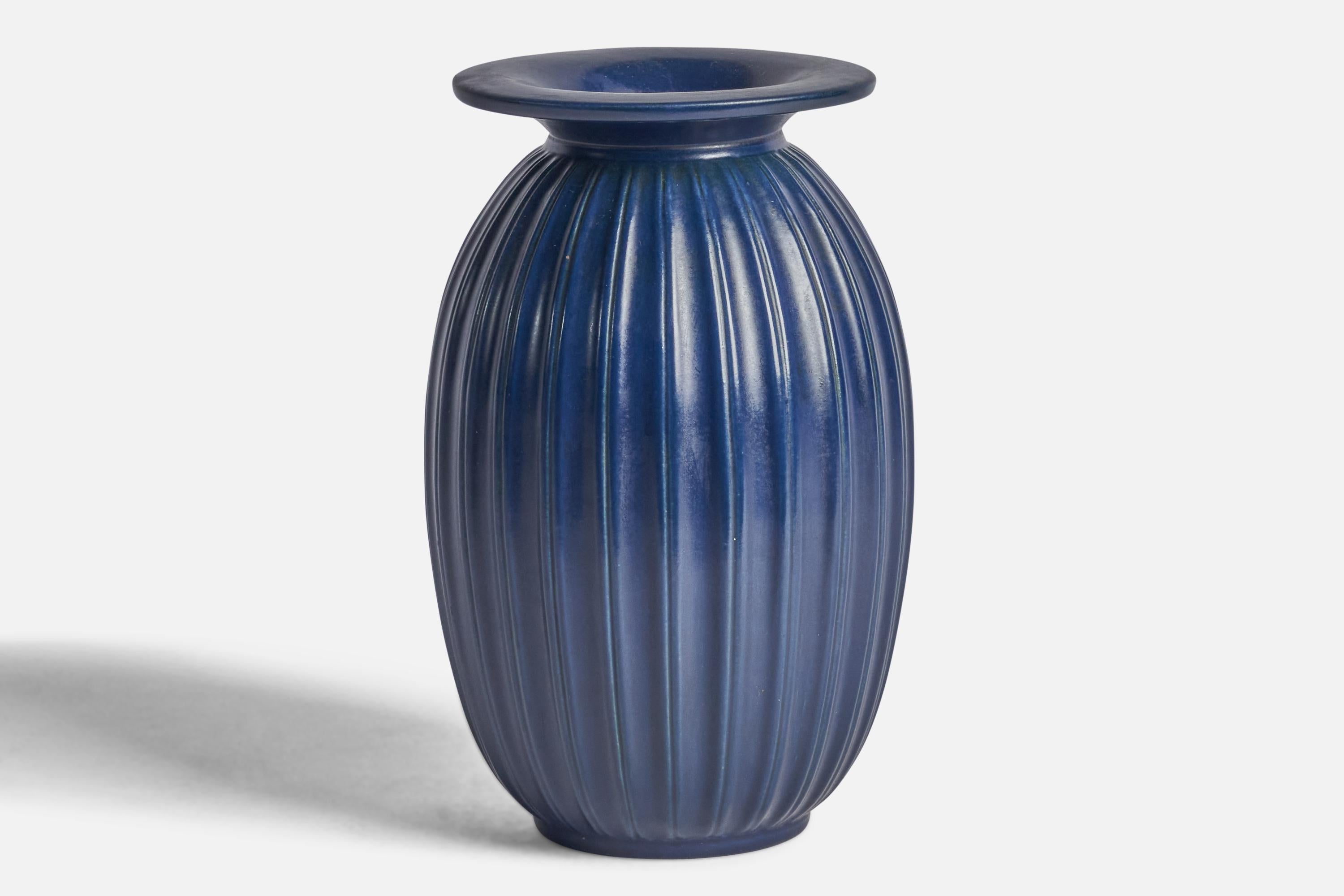 A blue-glazed fluted stoneware vase designed and produced by Peter Ipsens Enke, Denmark, 1940s.