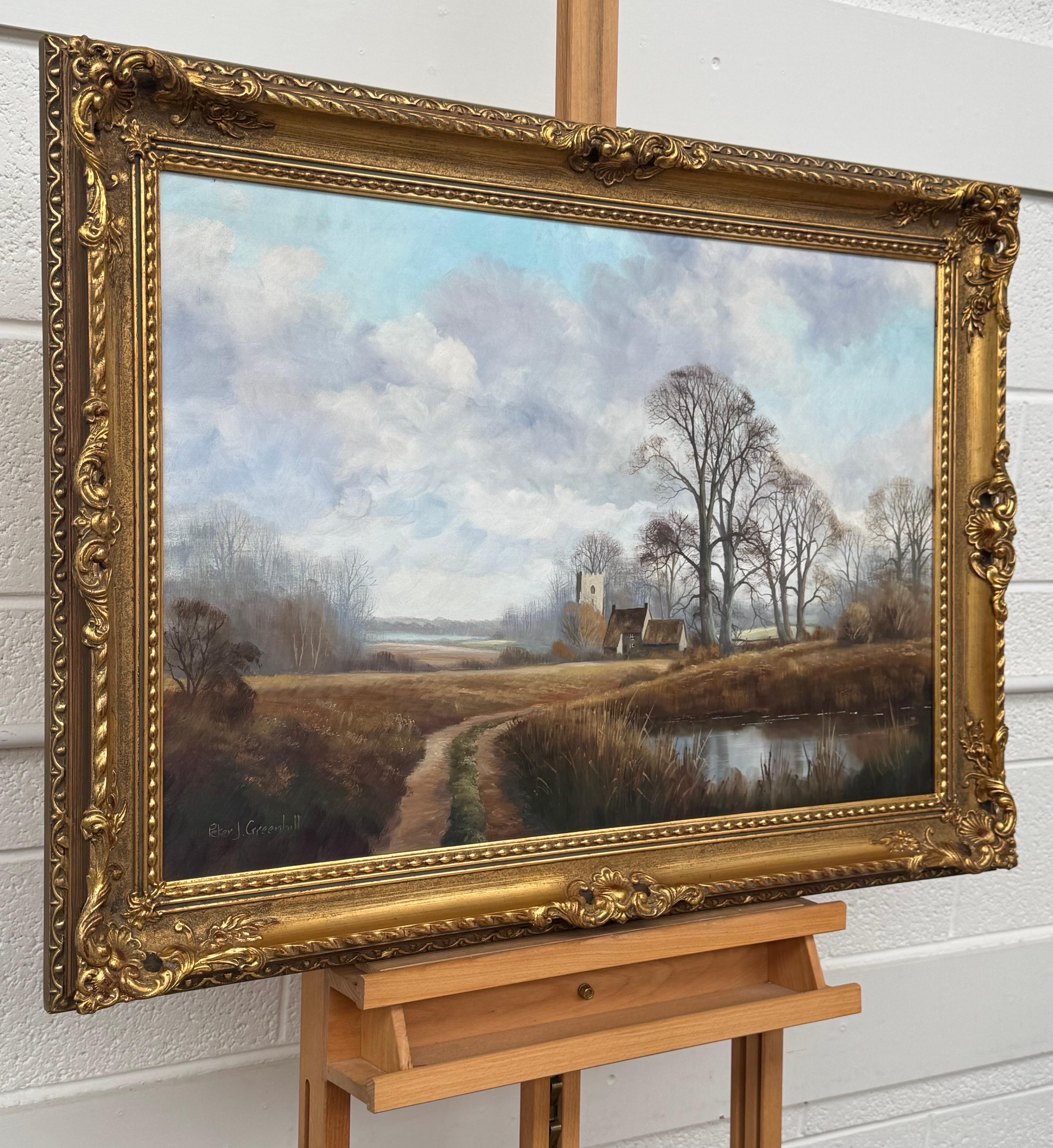 Church's et Cottage au bord d'une rivière dans la campagne anglaise par un artiste britannique - Painting de Peter J Greenhill