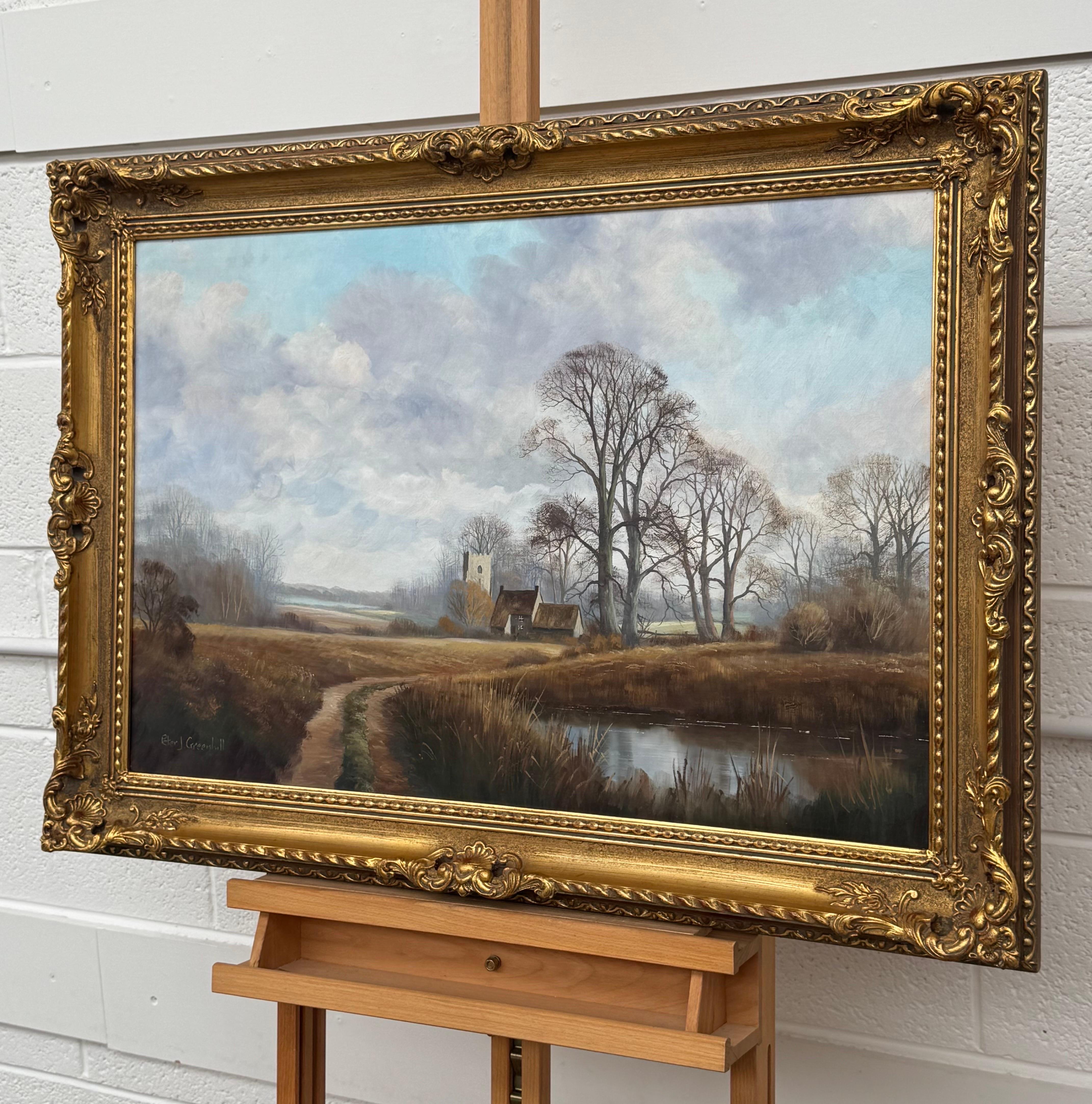 Church's et Cottage au bord d'une rivière dans la campagne anglaise par un artiste britannique - Marron Landscape Painting par Peter J Greenhill