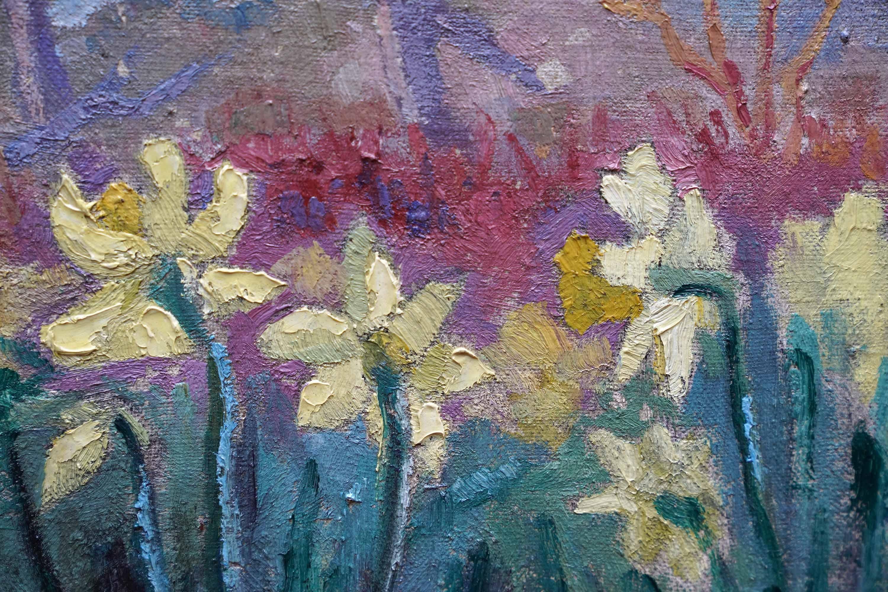 This superb British Post Impressionist landscape oil painting is by artist Peter Field. Painted circa 1955 on canvas, the composition is of daffodils in front of a lake with trees reflected in the water. The vivid yellow of the daffodils with great