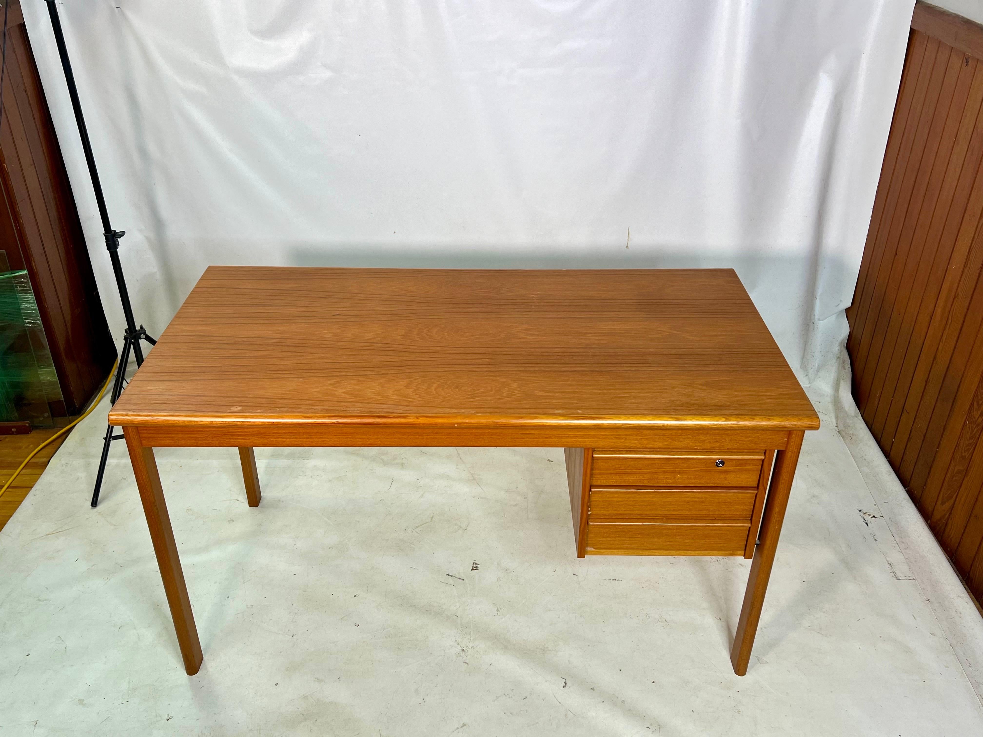 For sale is this very nice Danish Modern Teak desk with a sliding top. The desk was made by Peter Lovig