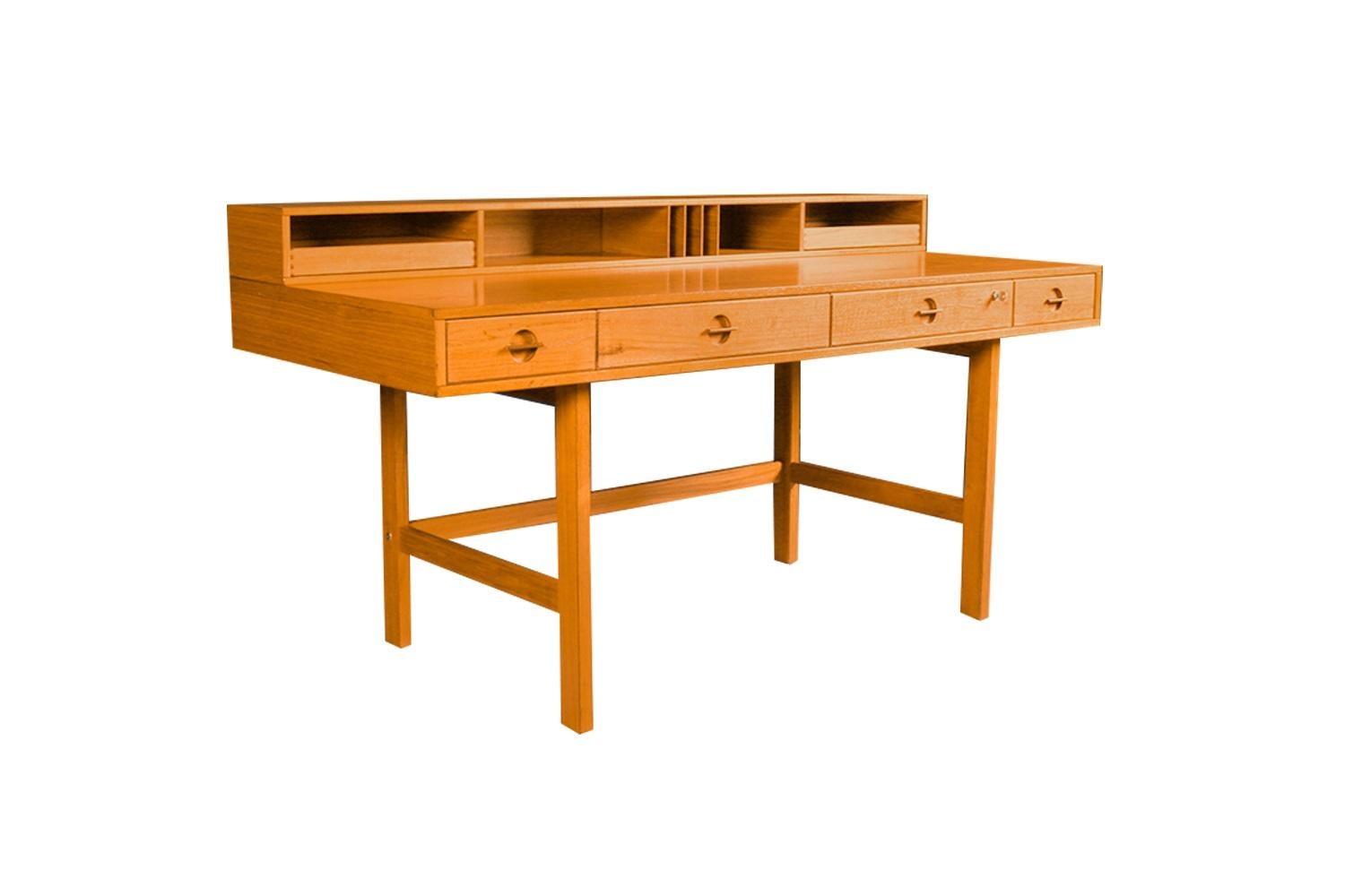 Fabulous highly collectible Danish Modern, mid century expandable, desk/table, designed by Jens Quistgaard of Dansk for Peter Løvig Nielsen, circa 1960s. A remarkable statement of quality in design executed to last the test of time, finely crafted
