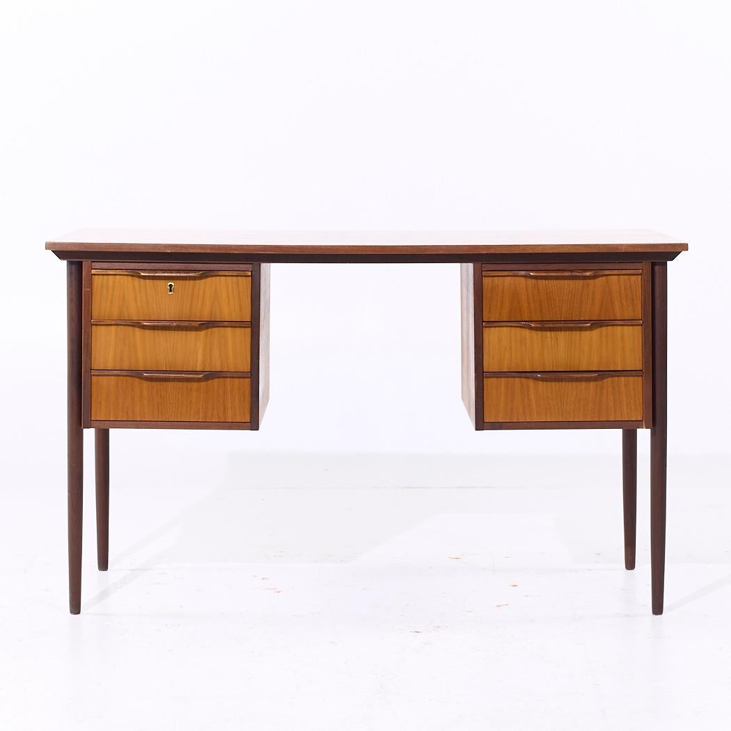 Peter Lovig Style Mid Century Danish Teak Desk

This desk measures: 48.5 wide x 23.5 deep x 29 high, with a chair clearance of 27.75 inches

All pieces of furniture can be had in what we call restored vintage condition. That means the piece is