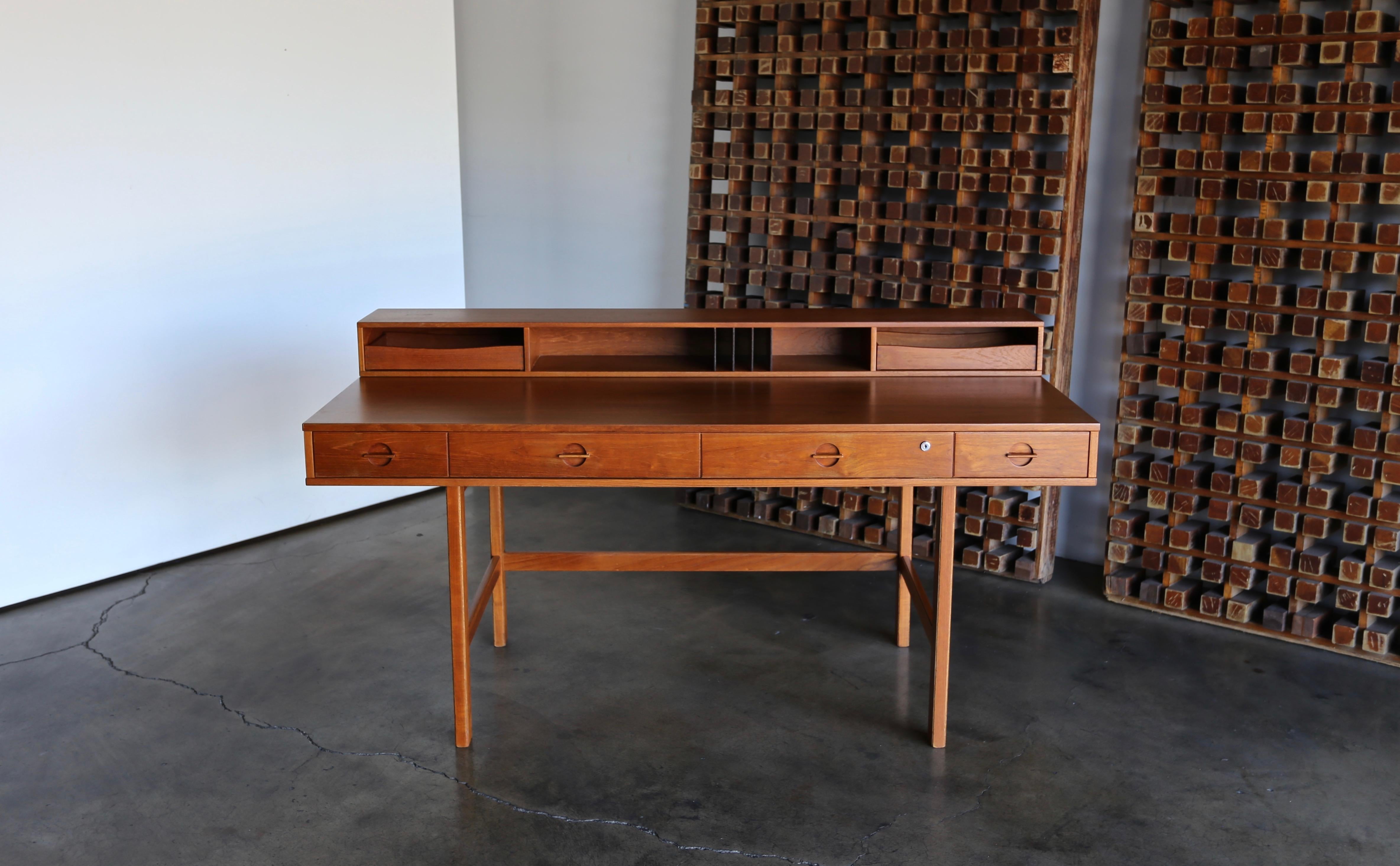 Peter Løvig Nielsen flip top teak desk, circa 1960. This piece has been professionally restored.
