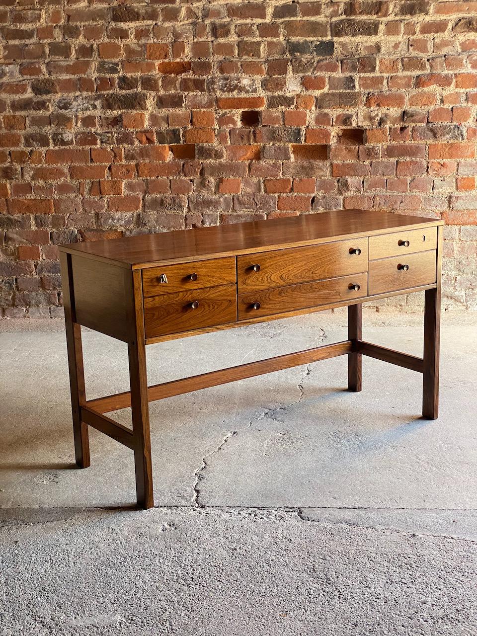 Peter Løvig Nielsen rosewood sideboard console table, Denmark, 1960.

Sublime quality mid century era Danish Peter Løvig Nielsen Rosewood Sideboard Console Table Denmark 1960, the rectangular top over two long and four short drawers all with