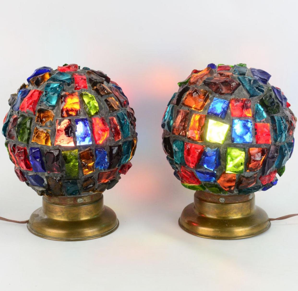 Rare and unique multicolor leaded glass globe lights by Peter Marsh for Nader. Beautiful and bright multicolored, dalle de verre, chunk glass squares come together in the shape of an 8” x 8” globe. These lights can be used as accent lighting in many
