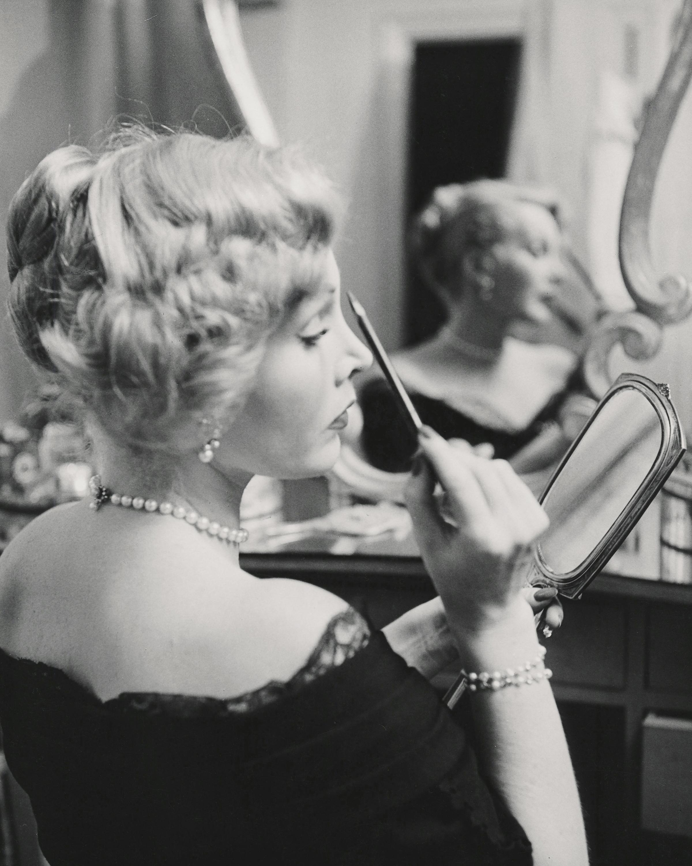 Peter Martin Portrait Photograph - Zsa Zsa Gabor Applying Makeup