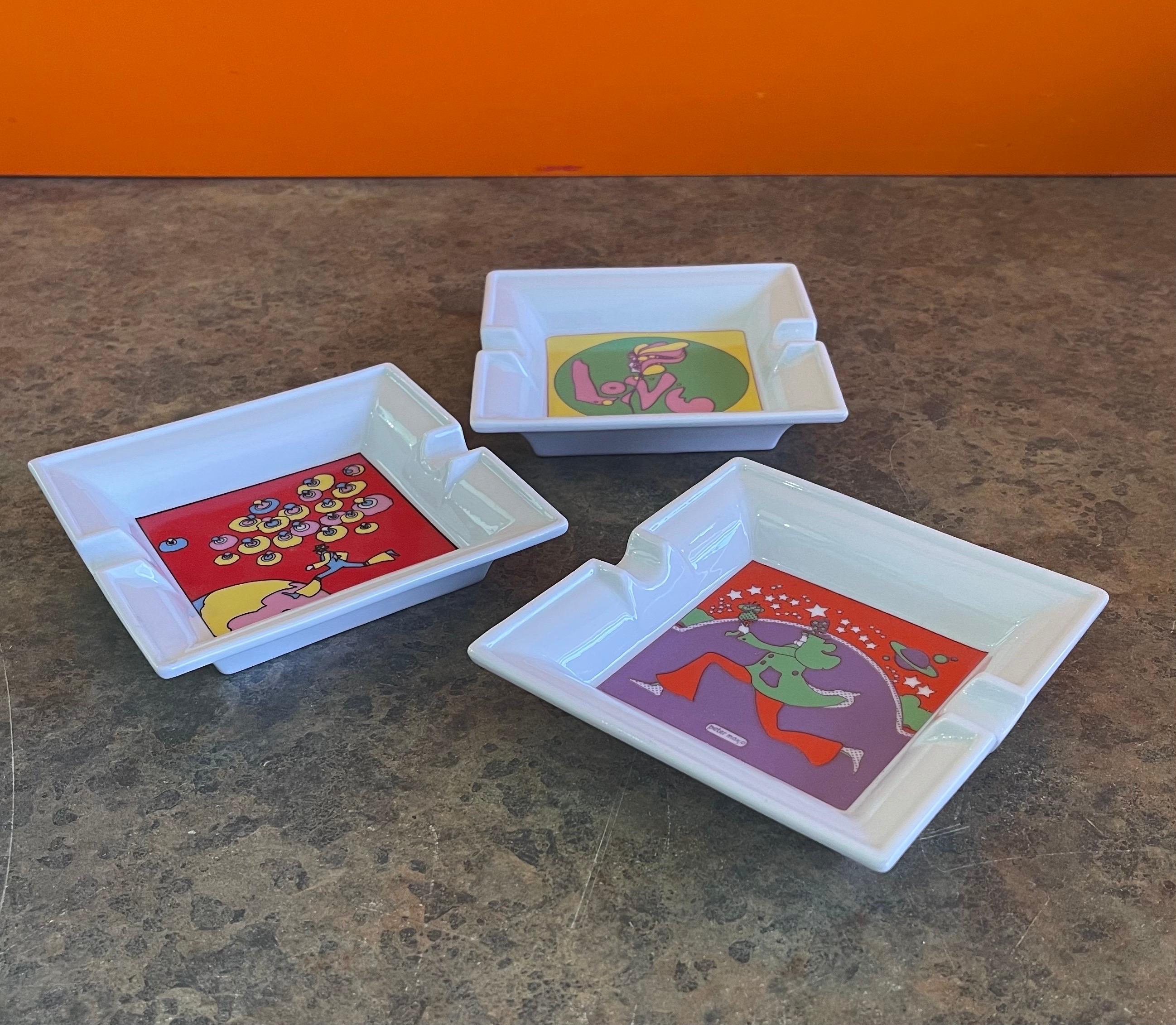 A very cool Peter Max pop art ceramic ashtray by Iroquois of Syracuse, NY, circa 1980s. There are three different ashtrays available; all are in excellent vintage condition with no chips or cracks and they measure 5.25