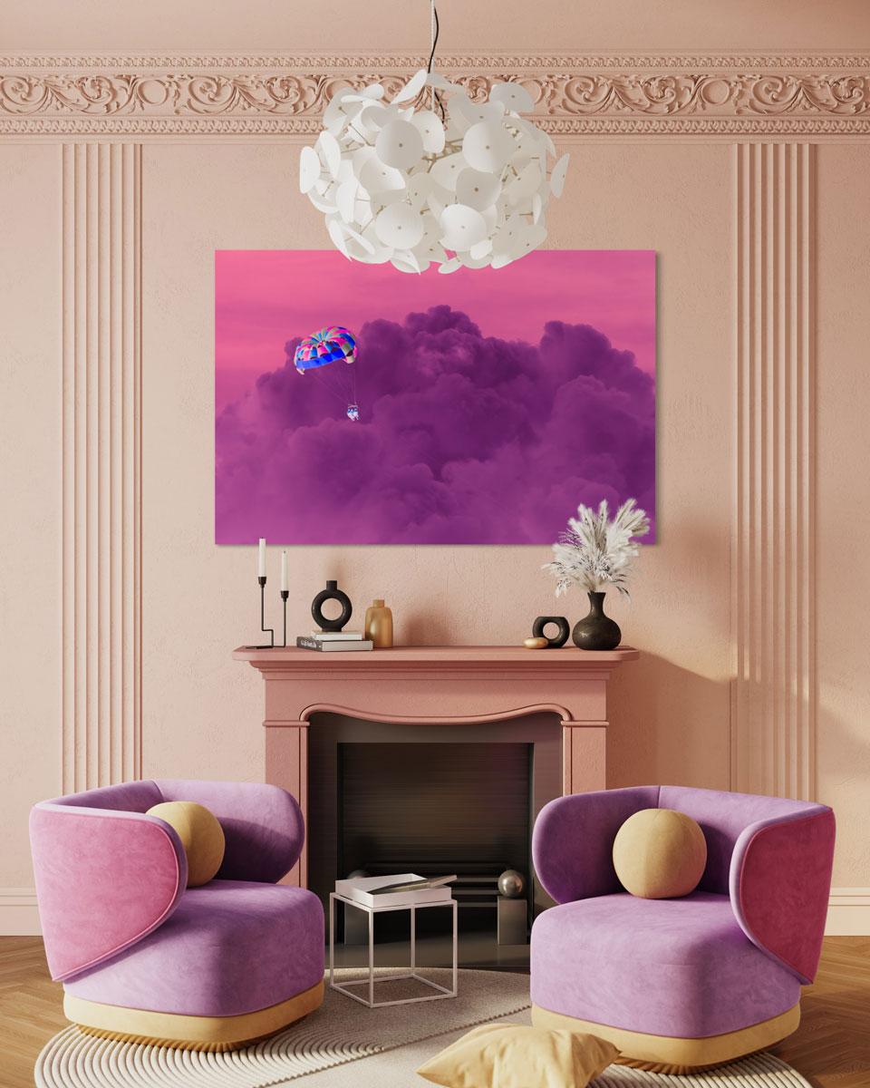 This contemporary photograph by Peter Mendelson is a metal sublimation print. It features a vibrant, warm palette and depicts people paragliding over fluffy purple clouds in a pink sky clouds.

This is a metal sublimation print. The frame on an